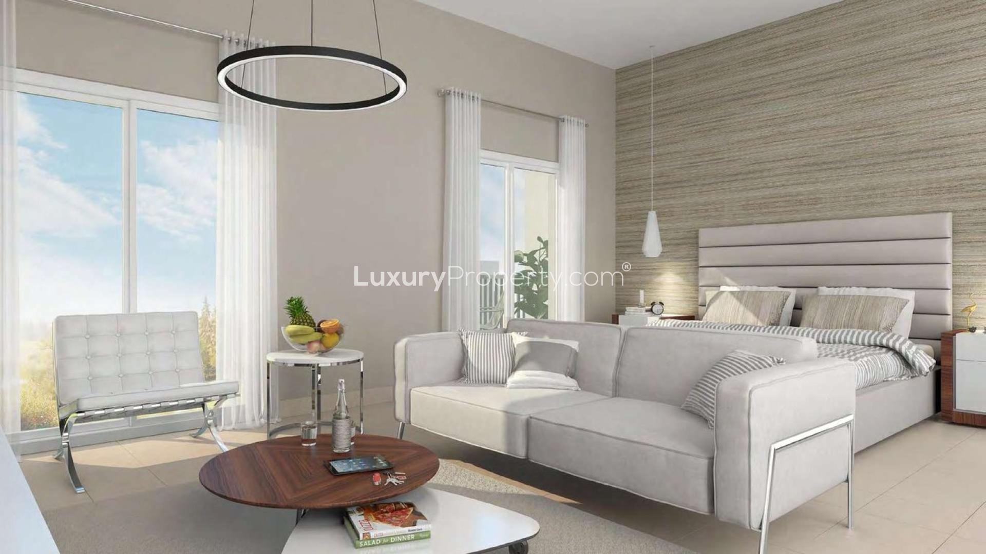 Aerial view of Remraam residential apartments with lush greenery in Dubailand district