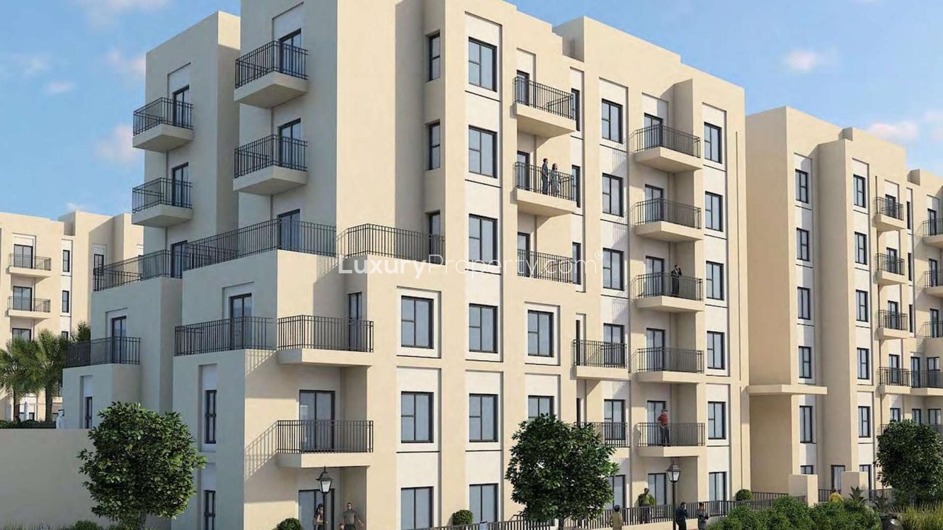 Contemporary two-bedroom apartment building exterior in Remraam, Dubailand, for sale
