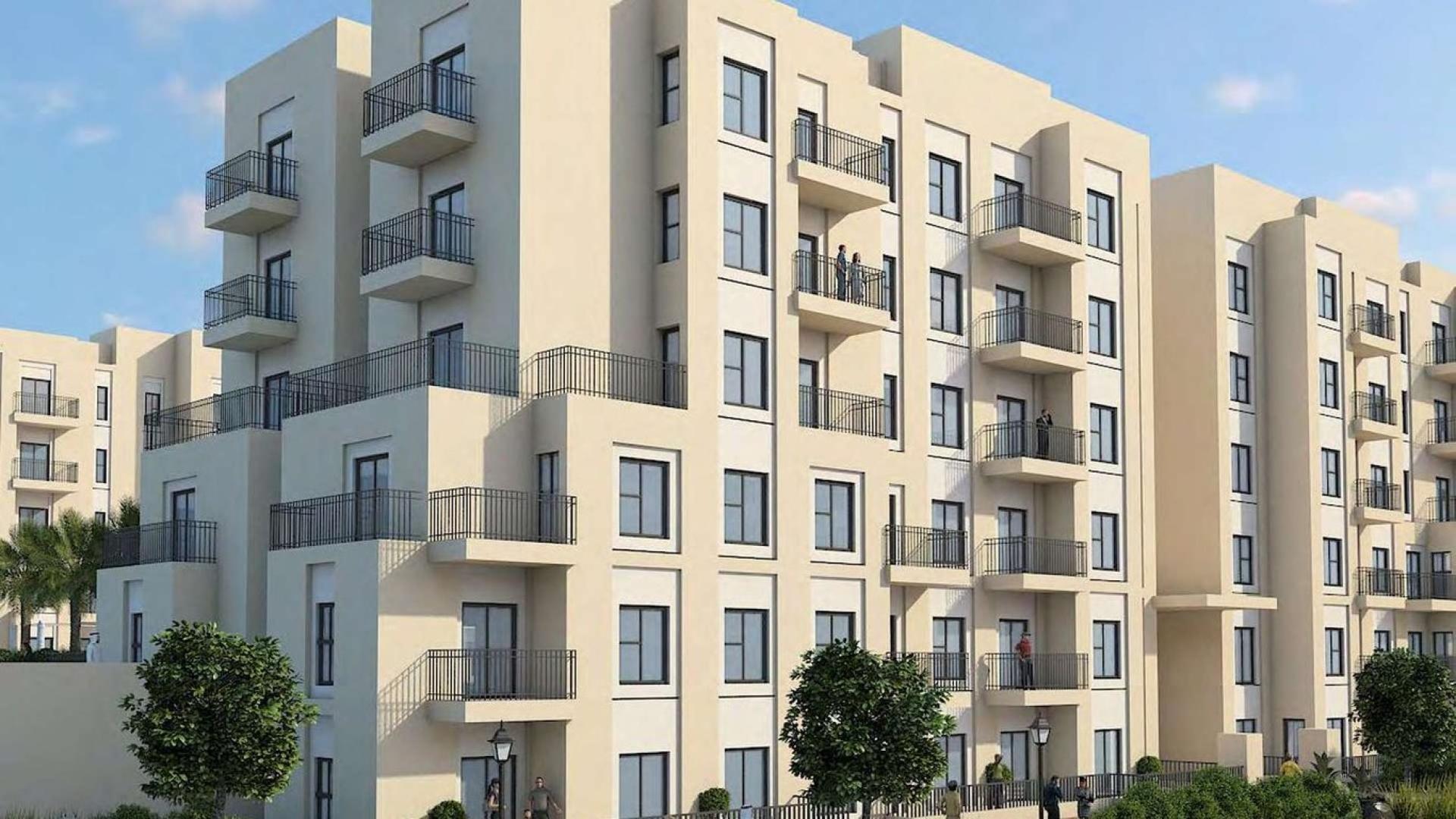 Luxurious one-bedroom apartment interior in Remraam, Dubailand with modern decor and natural light