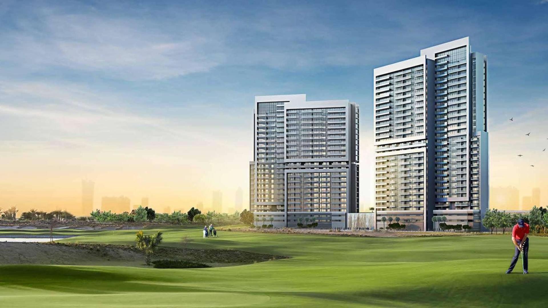 Modern living room in Golf Vita apartment, Damac Hills, with elegant decor and large windows