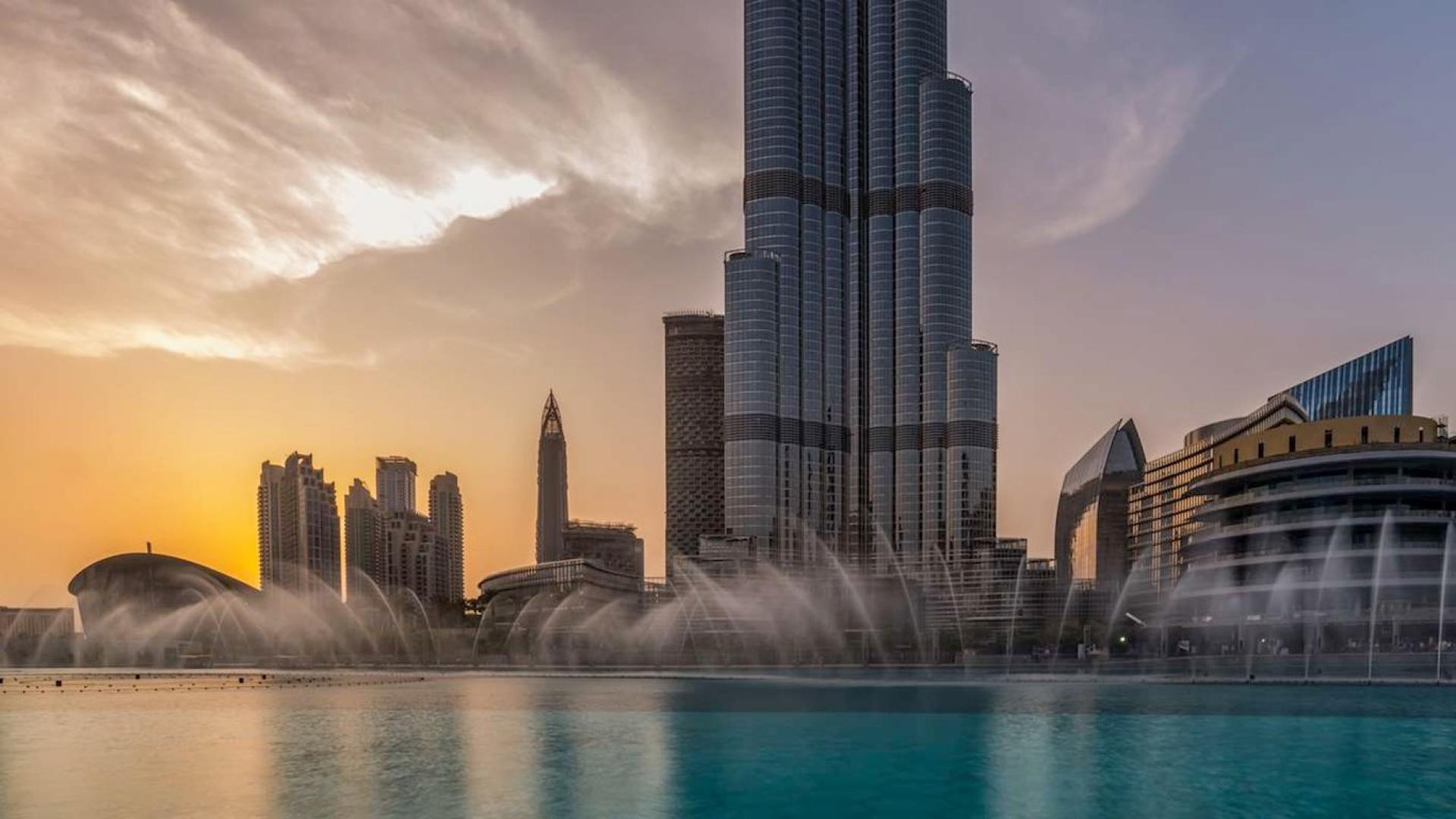 Burj Royale Downtown Dubai skyline with modern architecture and vibrant city life at dusk