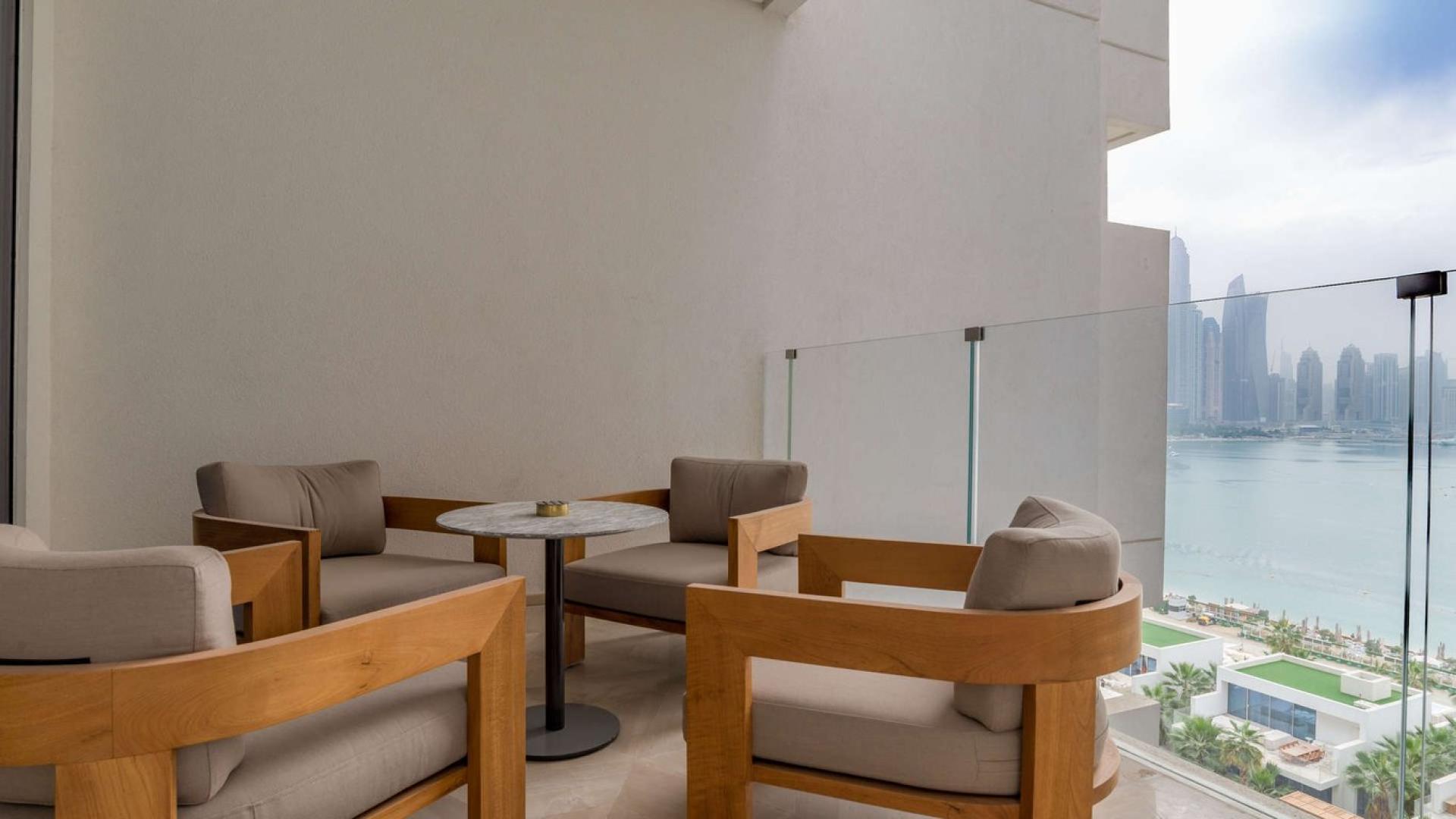 Modern living room in two-bedroom serviced apartment, Palm Jumeirah, with elegant furnishings and decor