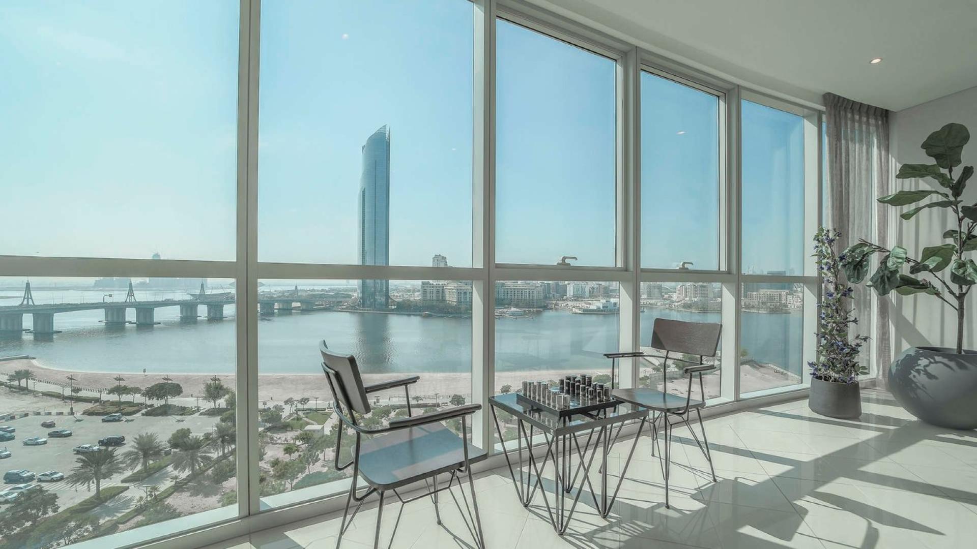 Modern living room in 2-bedroom Marsa Plaza apartment, Dubai Festival City, with city views
