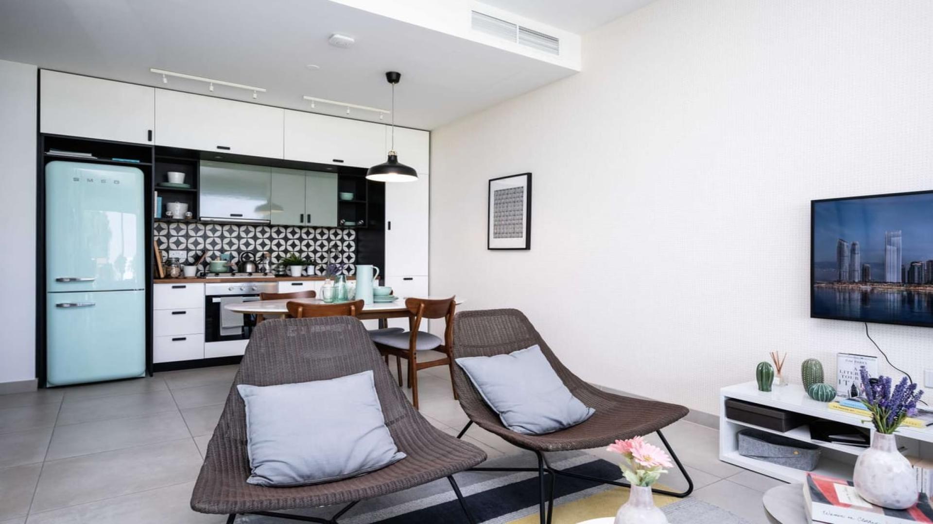 Modern kitchen in two-bedroom apartment, Collective 2.0, Dubai Hills Estate, featuring stylish decor