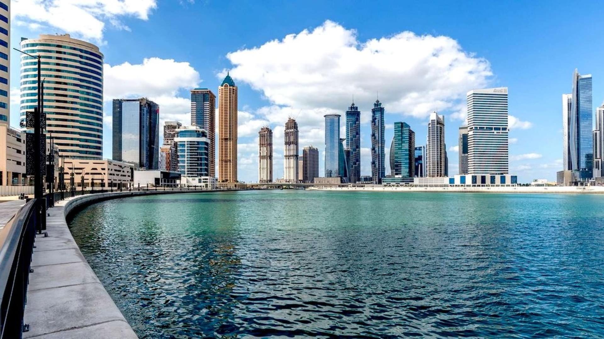 Luxurious lobby of Vera Residences apartment in Business Bay with modern decor and seating