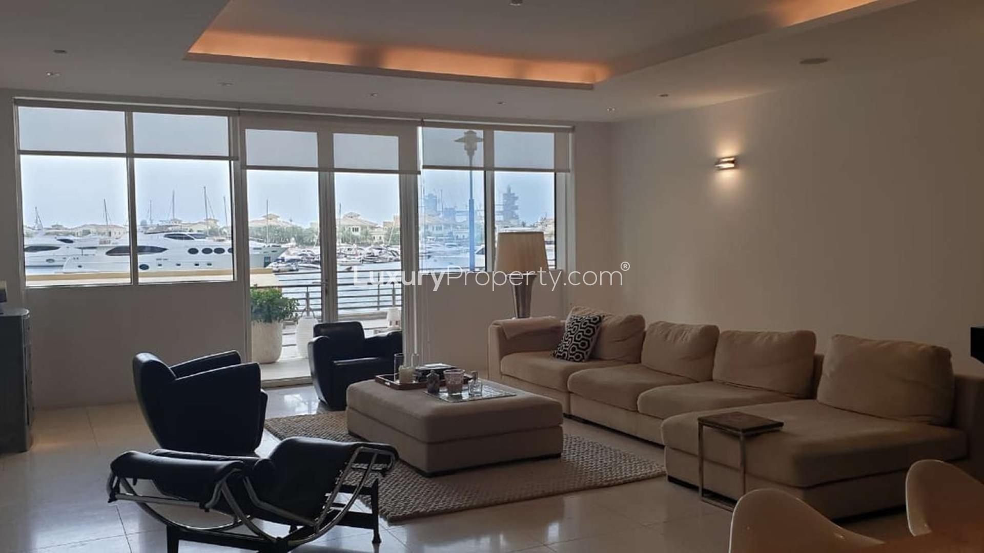 Spacious living room in Tiara Residence apartment, Palm Jumeirah, with modern decor and sea views