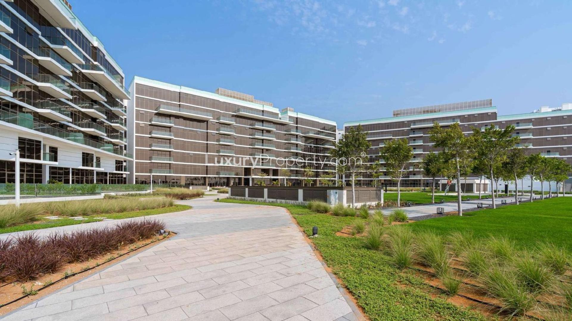 "High-floor Palm Jumeirah apartment with panoramic sea views, marble flooring, bright interior.",Modern apartment complex with lush landscaping in Palm Jumeirah's The Crescent community