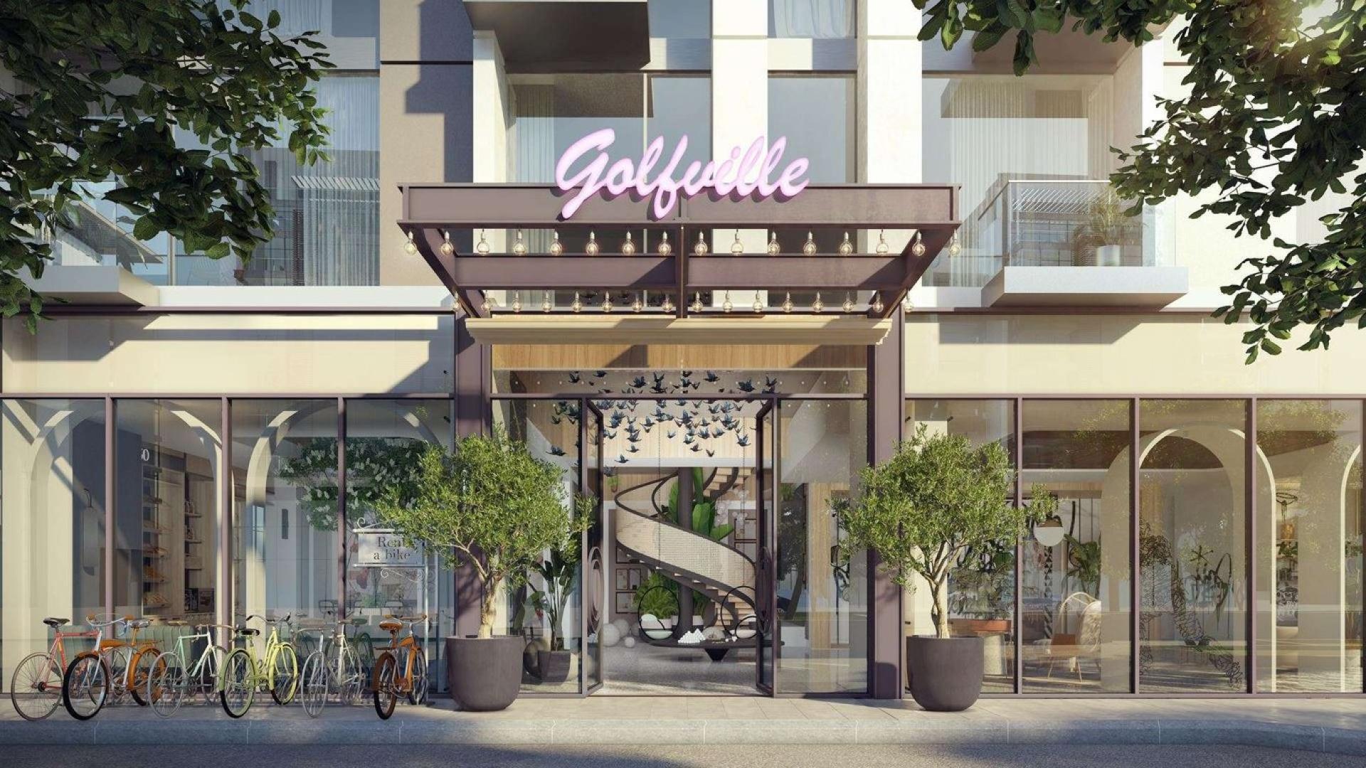 Modern Golfville apartment buildings in Dubai Hills Estate with lush green surroundings