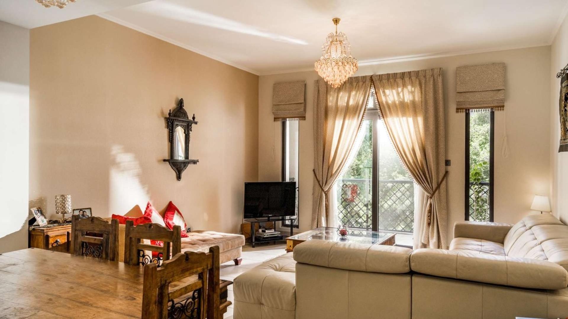 Dining area in two-bedroom apartment, Yansoon, Old Town, Downtown. Elegant decor and wooden furniture