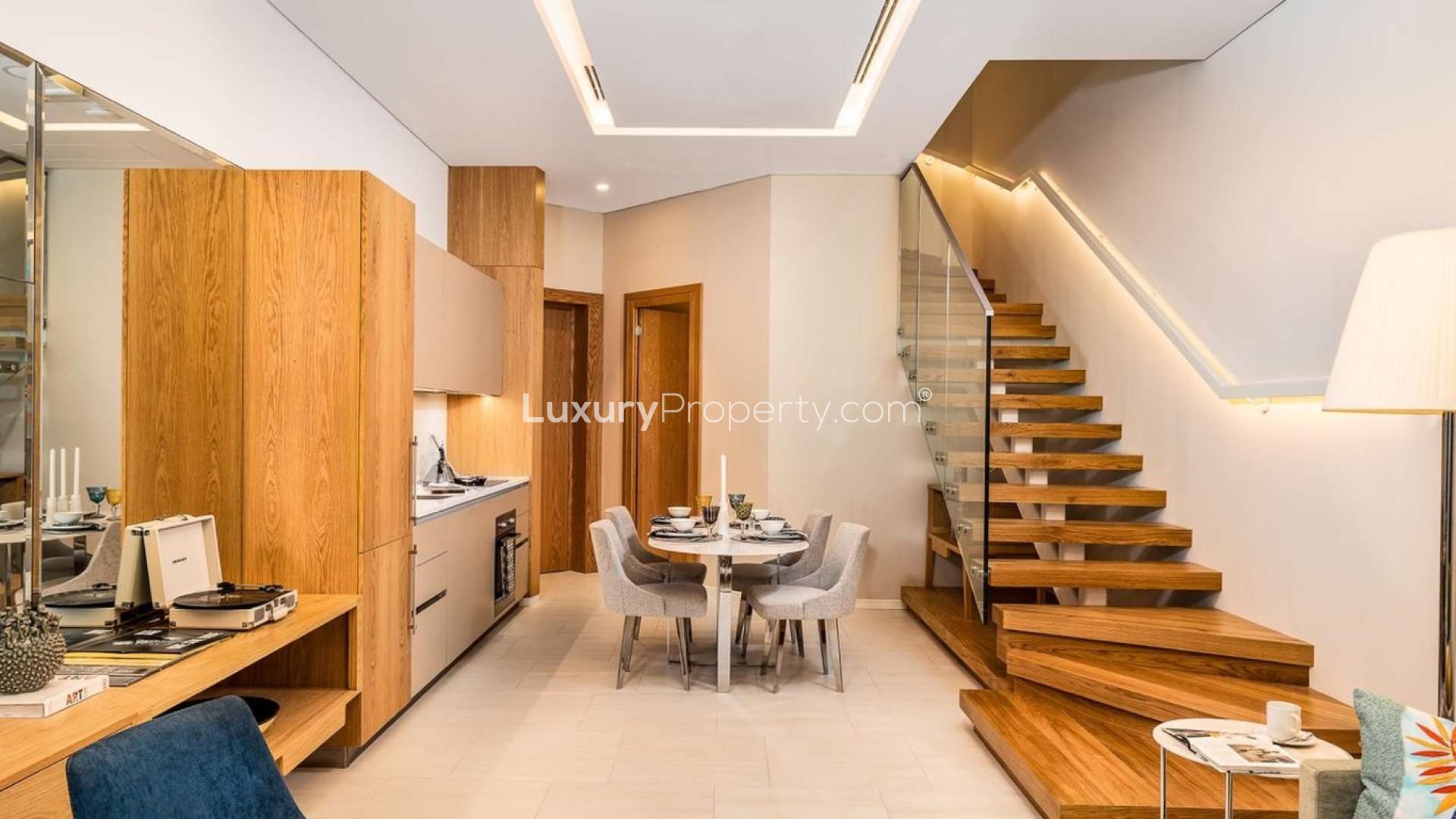 Modern kitchen and dining area in two-bed duplex at SLS Dubai Hotel Residences