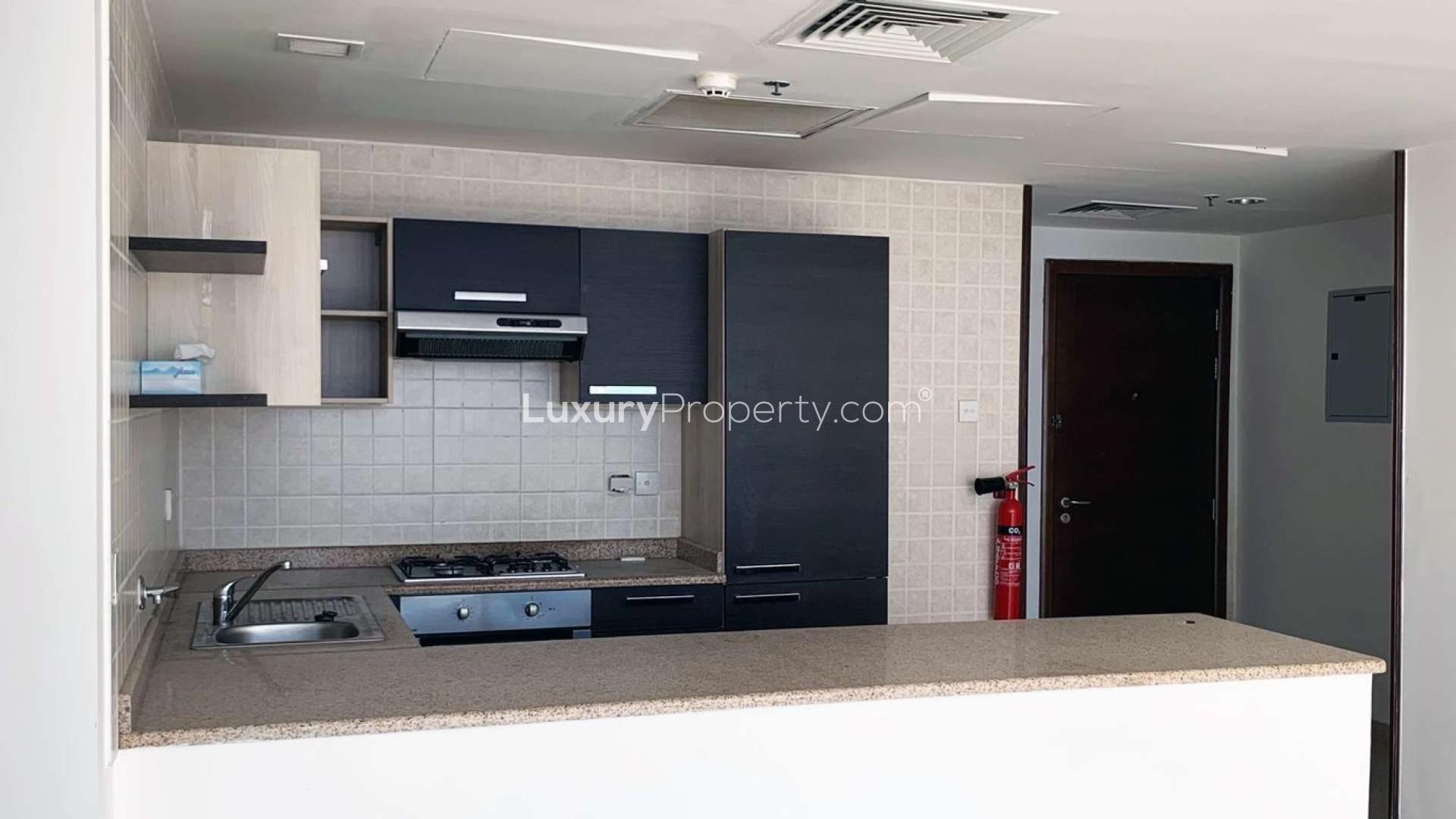 Spacious living area with large windows in Ontario Tower, Business Bay apartment for sale