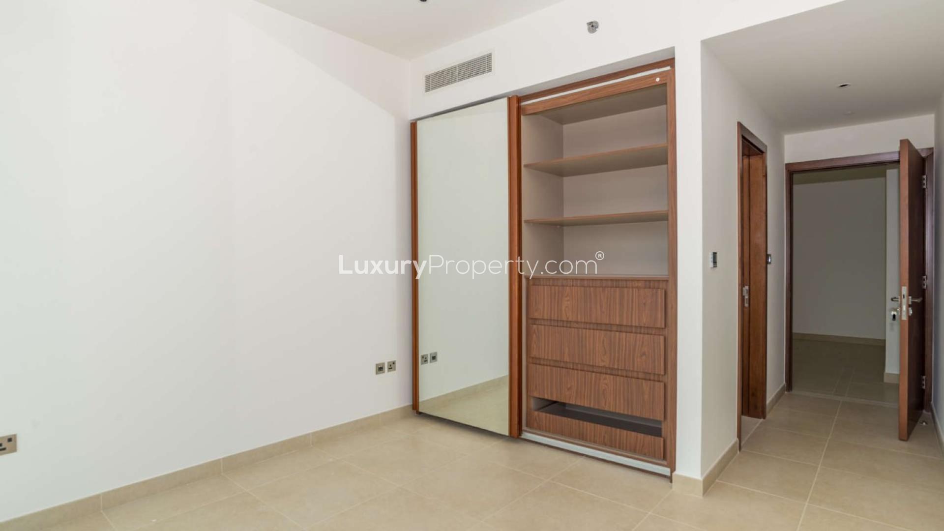 Modern kitchen and living area in Jumeirah Living Marina Gate apartment, Dubai Marina