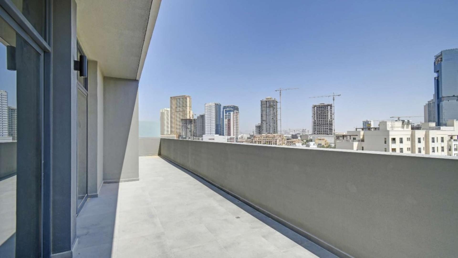 Spacious balcony view from 2-bedroom apartment in Belgravia II, Jumeirah Village Circle