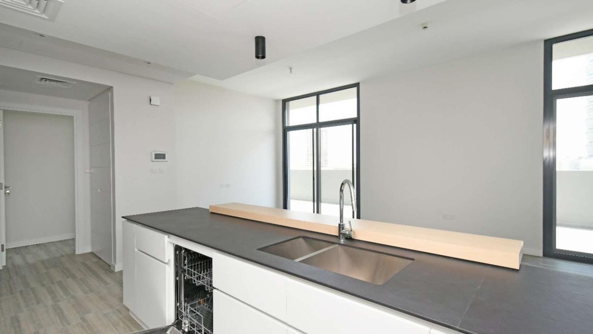 Modern apartment complex with pool view in Belgravia II, Jumeirah Village Circle, Dubai