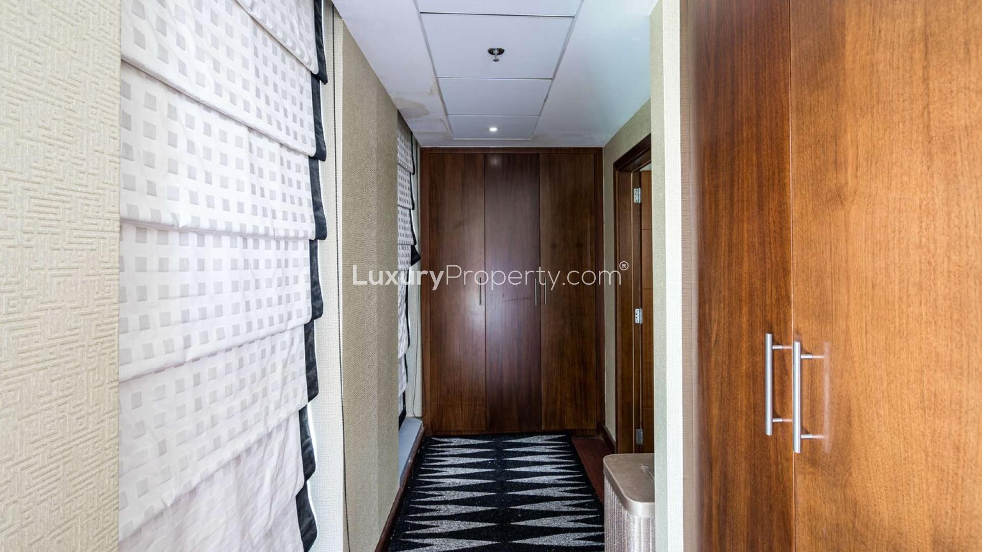 Luxurious furnished living room with balcony and fountain view in Standpoint Towers, Downtown Dubai