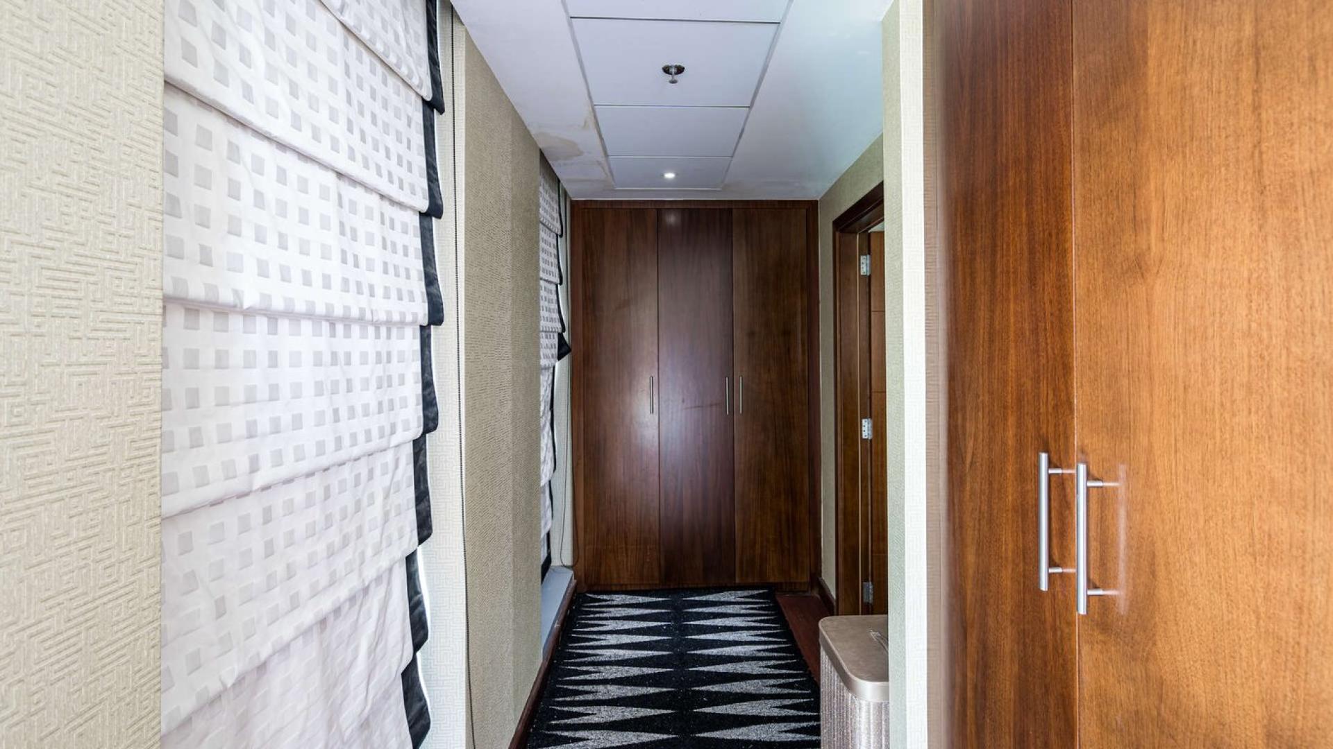 Luxurious furnished living room with balcony and fountain view in Standpoint Towers, Downtown Dubai