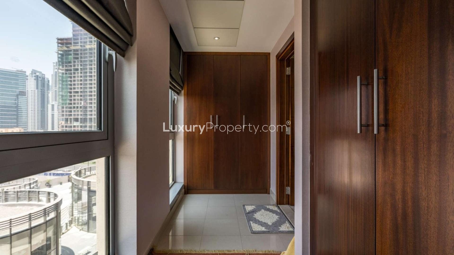 Stylish living room in Standpoint Towers apartment, Downtown Dubai with balcony and city view