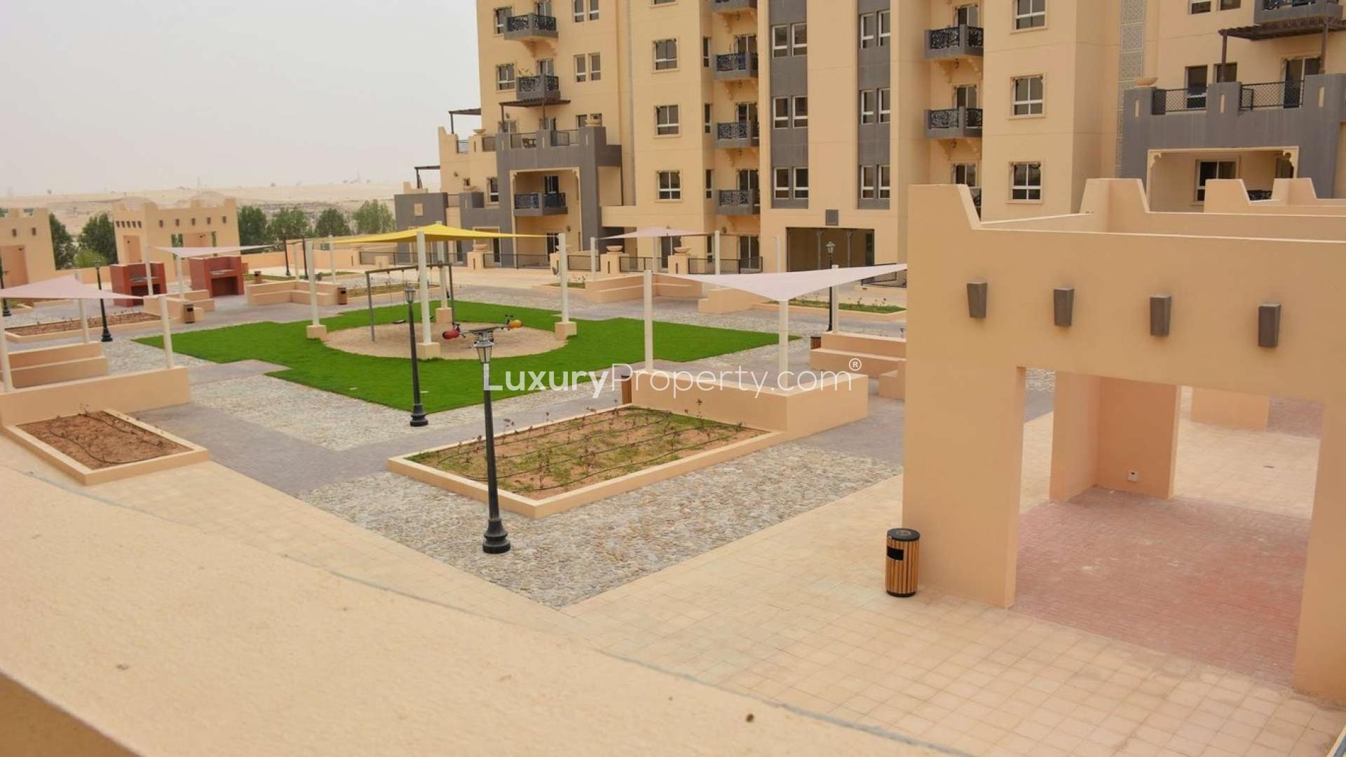 Sunny balcony view from 2-bedroom apartment in Al Thamam, Remraam, Dubailand for sale