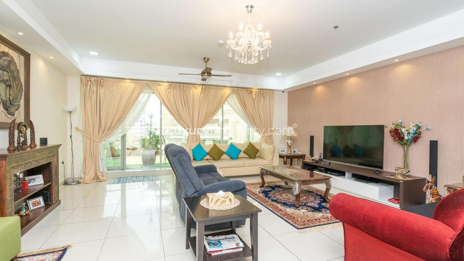 Aerial view of Dubai Sports City from penthouse terrace at Arena Apartments, lush greenery visible