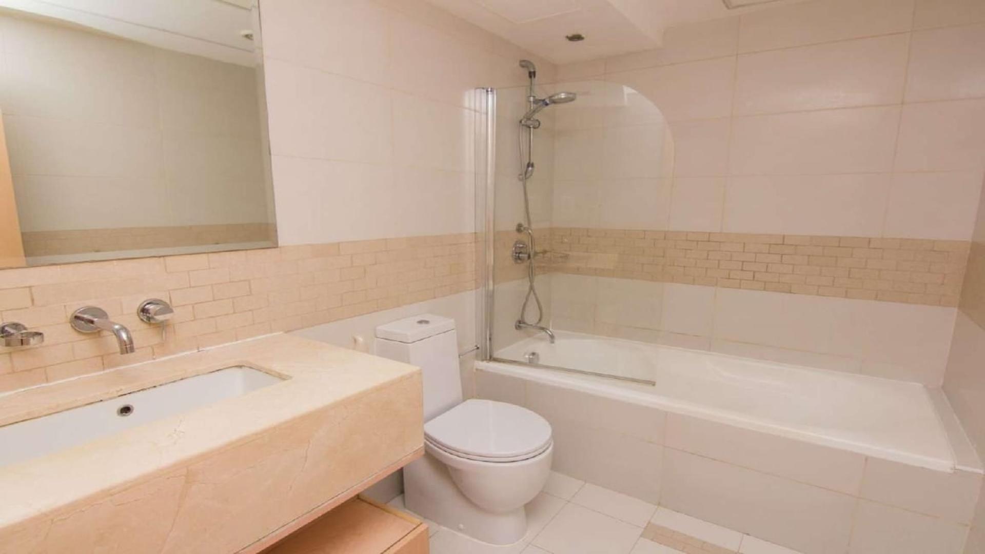 Bright living room with panoramic windows in Dubai Marina apartment, Park Island community