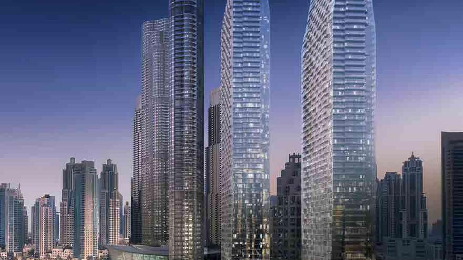 "Modern architecture at The Address Residences Dubai Opera, Downtown Dubai, vibrant community scene.",Exterior view of The Address Residences Dubai Opera, Downtown Dubai, vibrant community setting