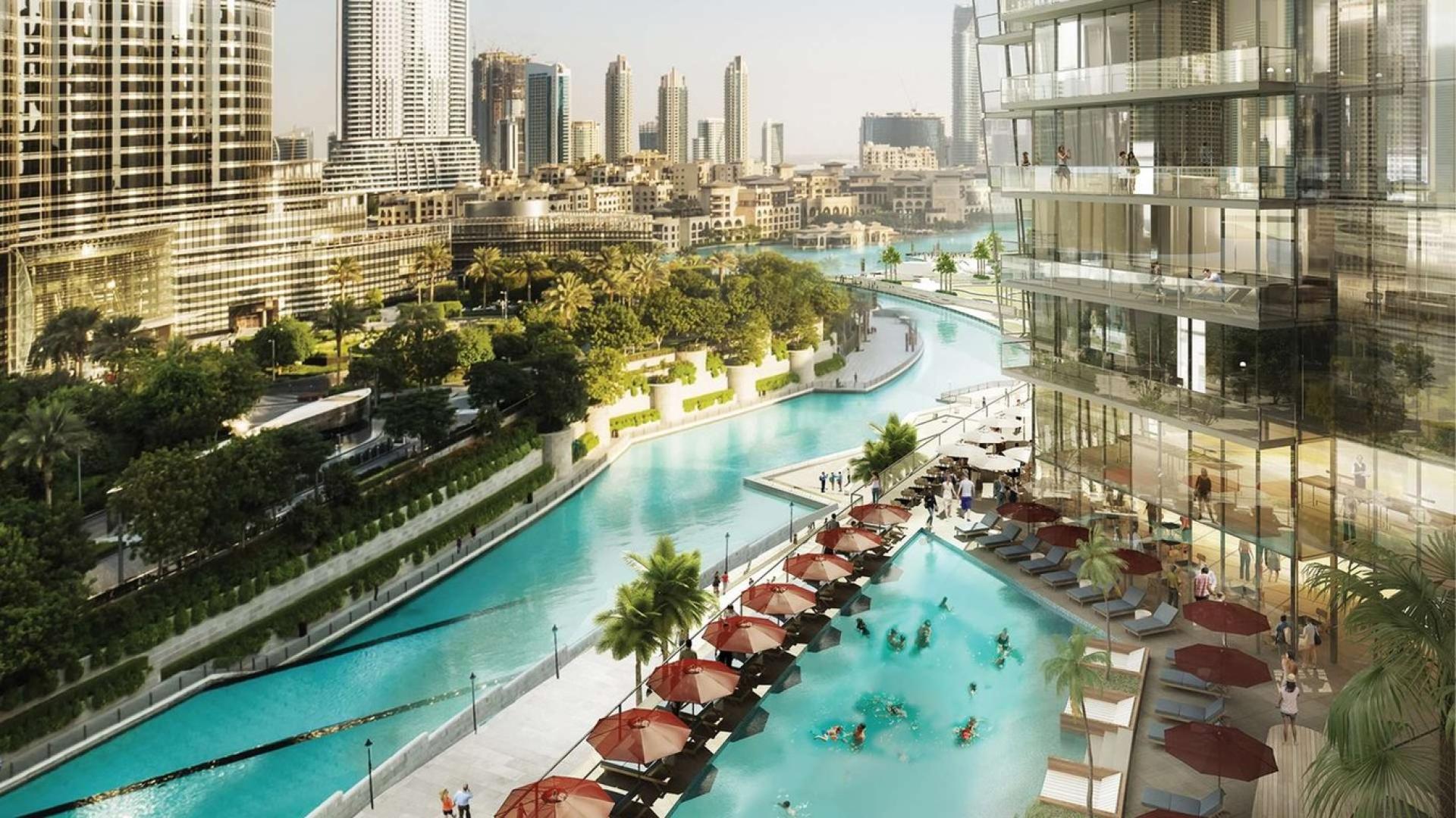 "Modern high-rise apartments at The Address Residences Dubai Opera, Downtown Dubai skyline view.","Luxurious poolside view at The Address Residences Dubai Opera, Downtown Dubai apartment for sale.",High-rise apartments at The Address Residences Dubai Opera in Downtown Dubai, skyline view