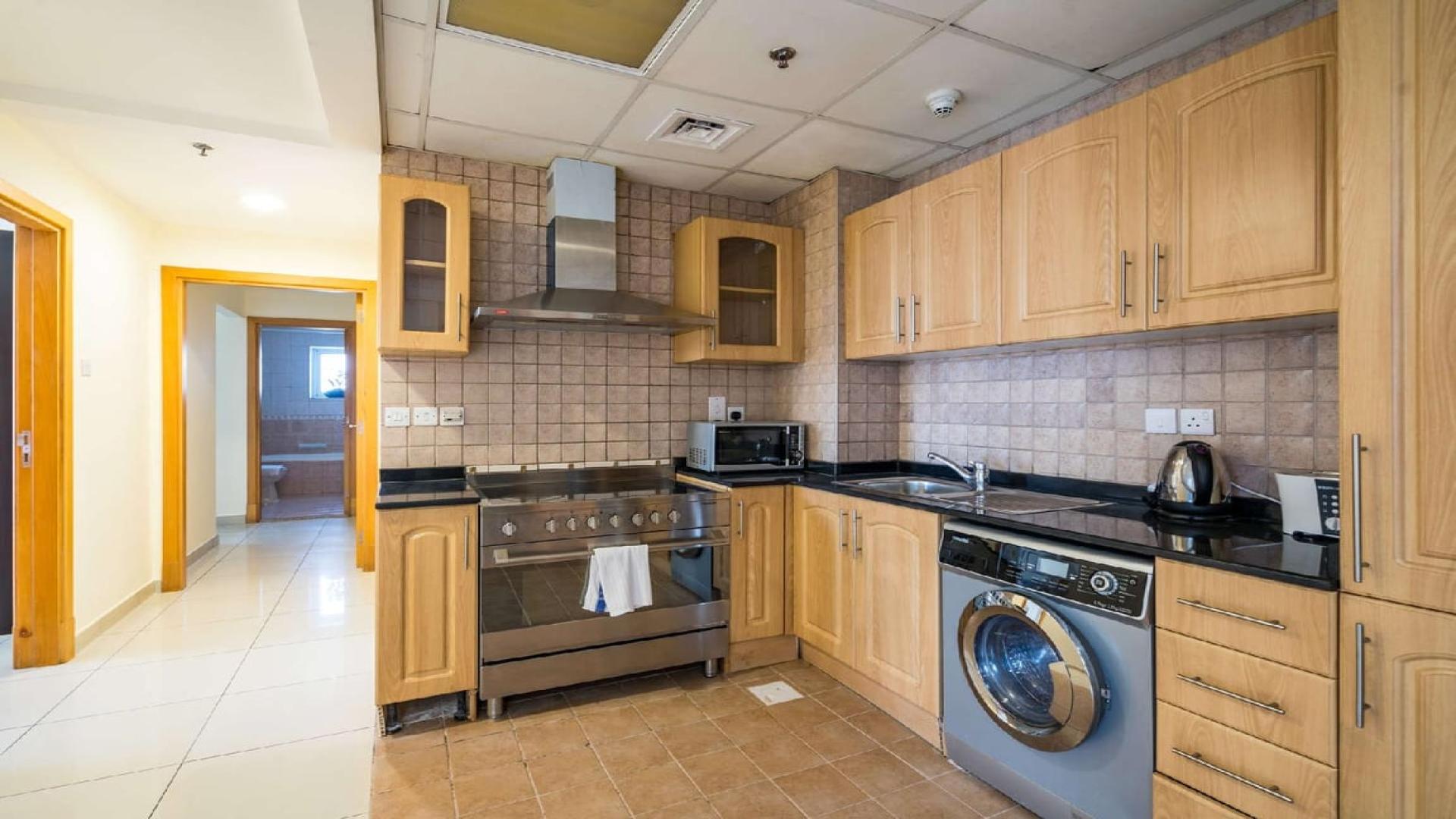 Living room in 2-bedroom apartment, Armada Tower 3, JLT, with modern furniture and city views