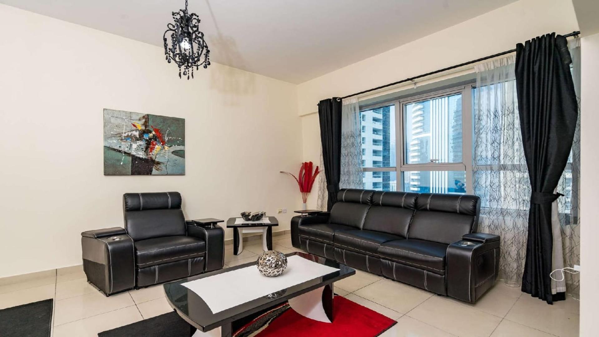 Modern living room in Armada Tower 3 apartment, JLT, with stylish decor and furnishings