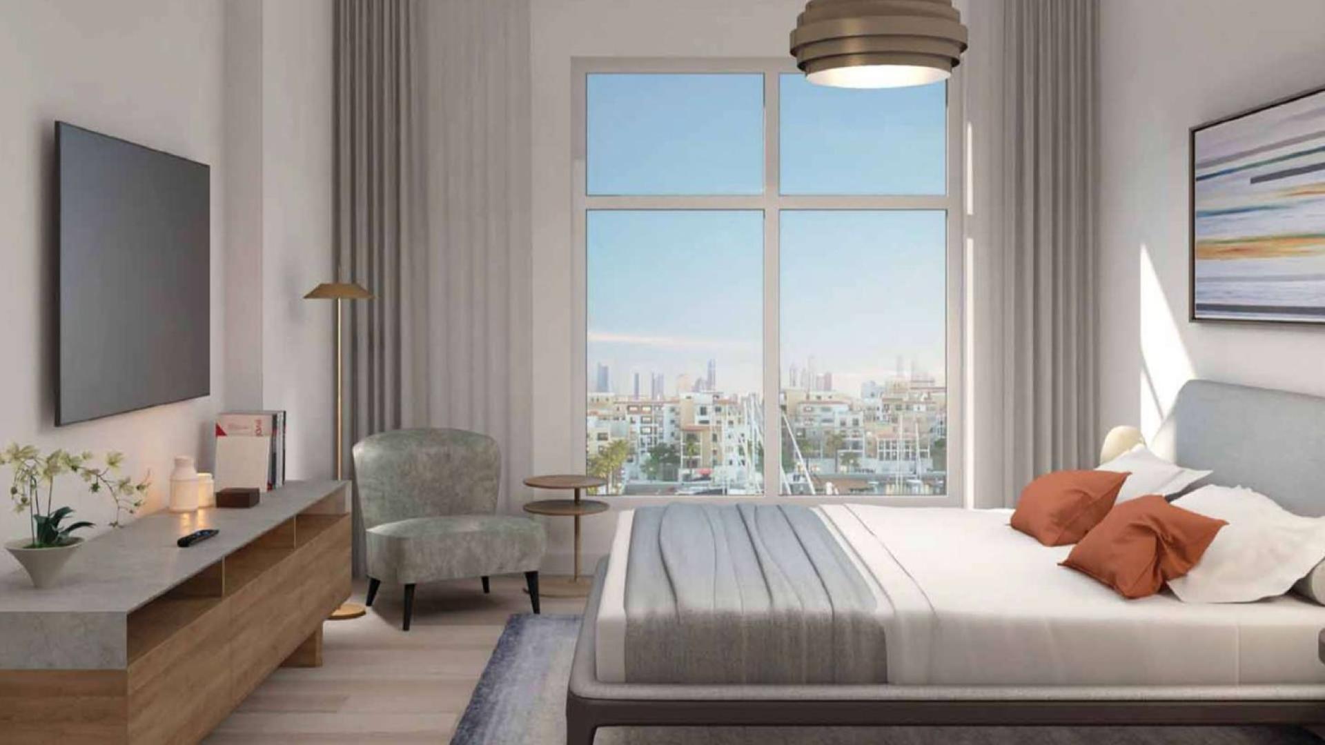 Modern living room and dining area in two-bed apartment, La Voile, Jumeirah, for sale