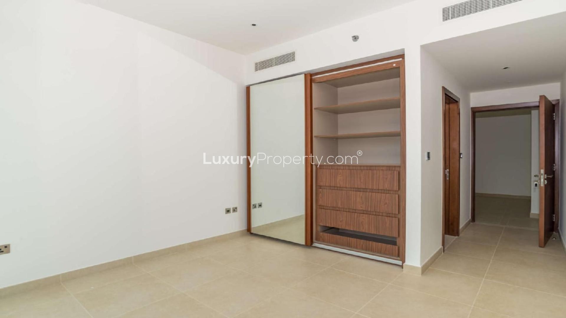 "Modern kitchen with city view in 2-bedroom Marina Gate 2 apartment, Dubai Marina for sale.",Empty bedroom with built-in wardrobe at Marina Gate 2 apartment, Dubai Marina
