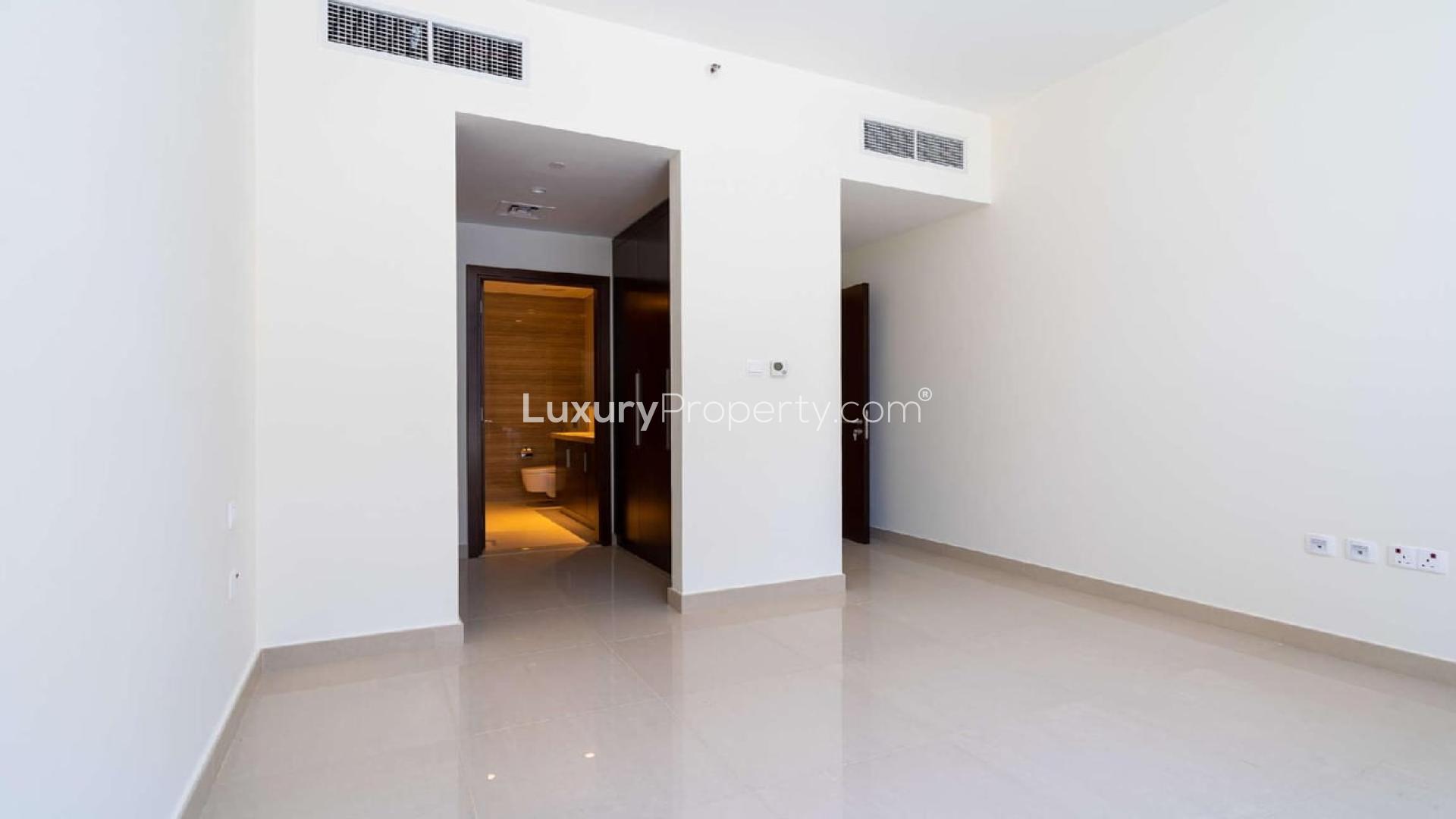 Bright living room with large windows in Dubai Hills Estate apartment for sale