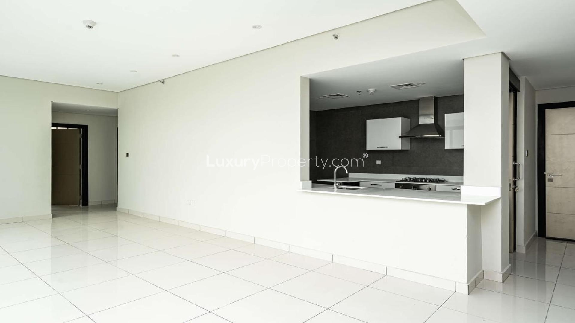 Modern kitchen in two-bedroom Meydan Avenue apartment for sale, featuring sleek white cabinetry