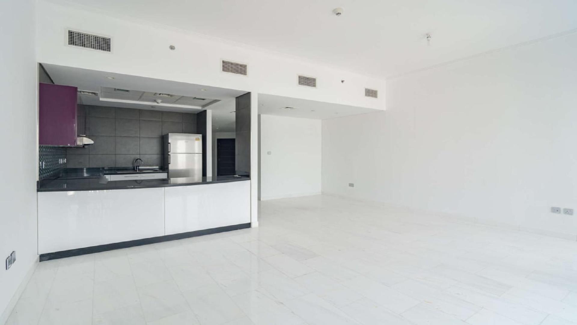 Luxurious studio apartment interior with modern kitchen in Cayan Tower, Dubai Marina for sale
