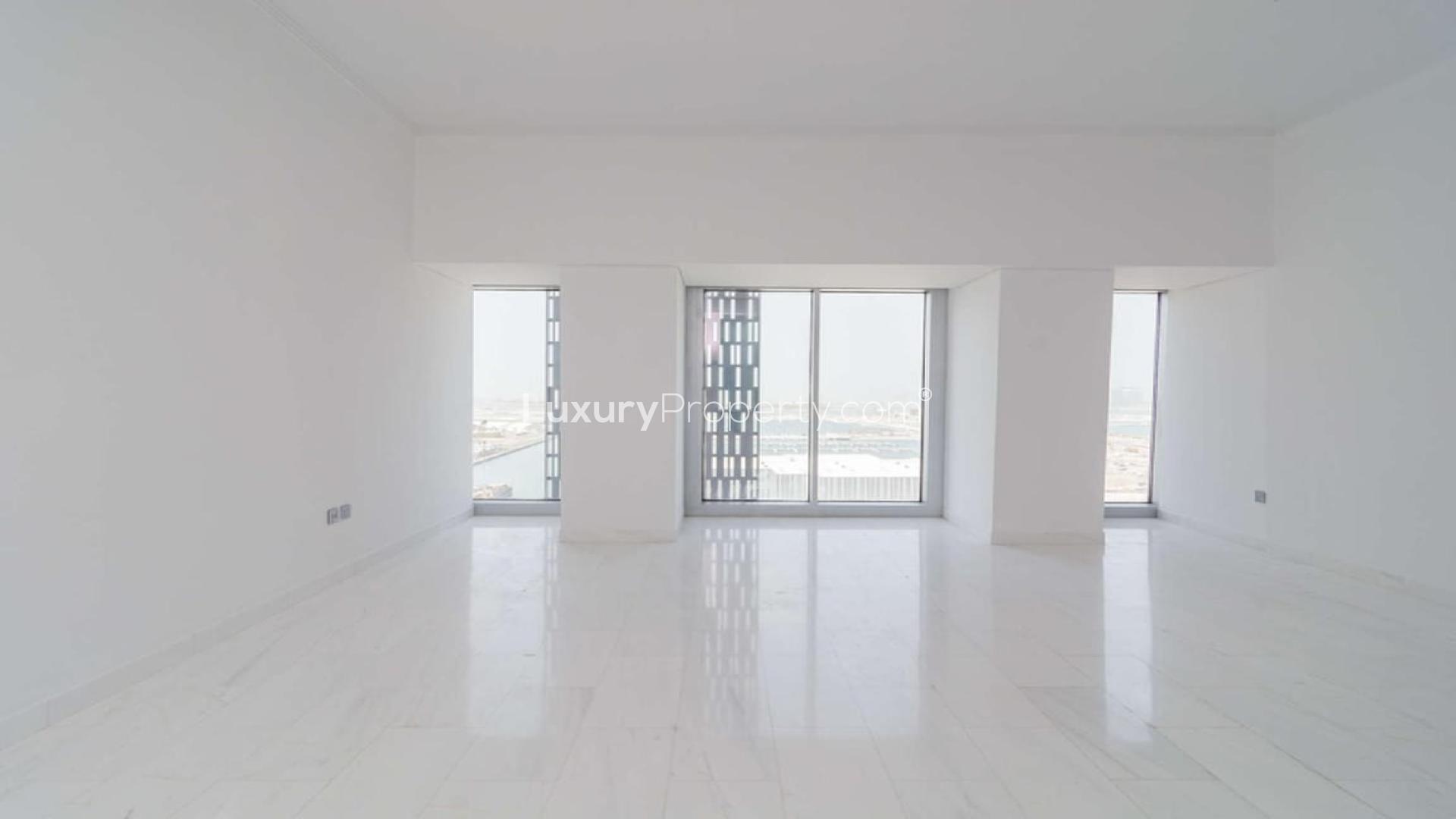 Spacious, bright apartment interior with large windows in Cayan Tower, Dubai Marina