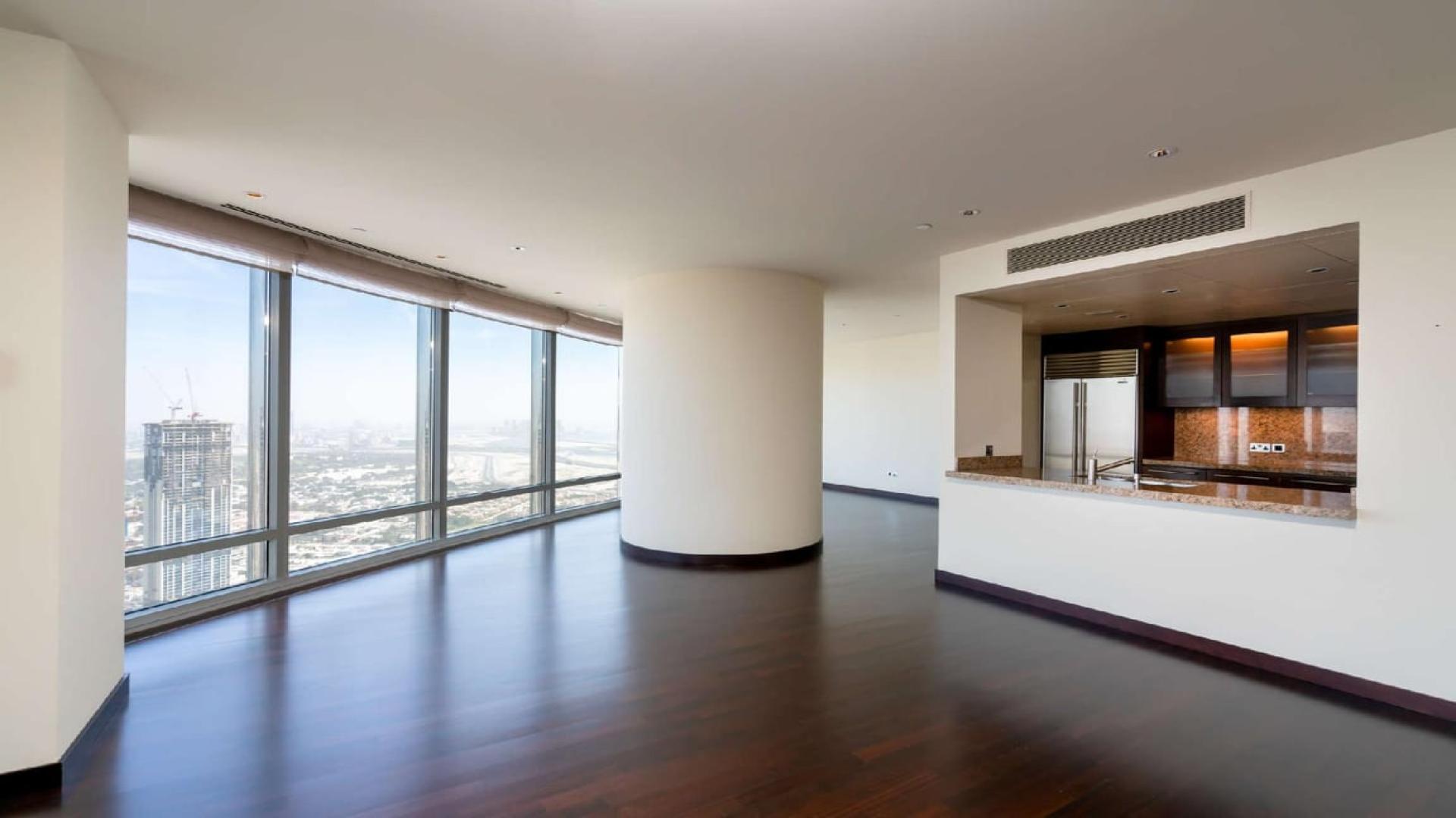 Spacious living room with skyline views in Burj Khalifa apartment for sale, Downtown Dubai