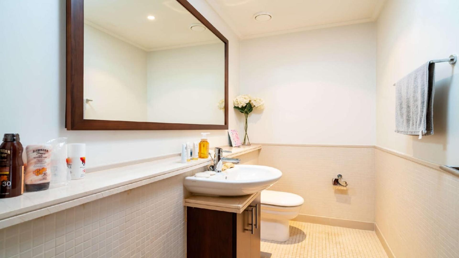 Luxurious living room in Dubai Marina apartment with marina views and elegant decor