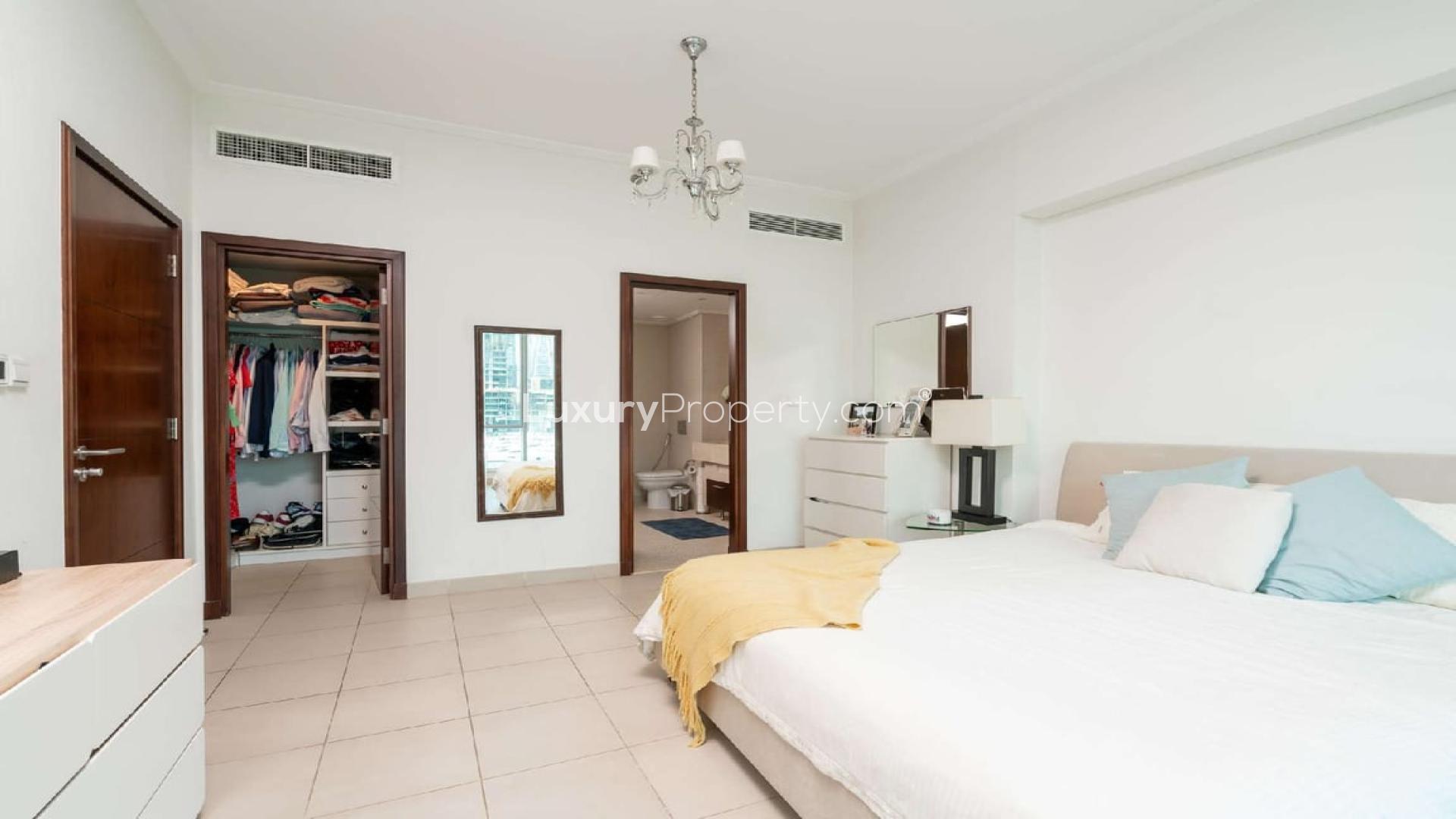 Modern living room in Dubai Marina apartment, featuring elegant decor and marina views