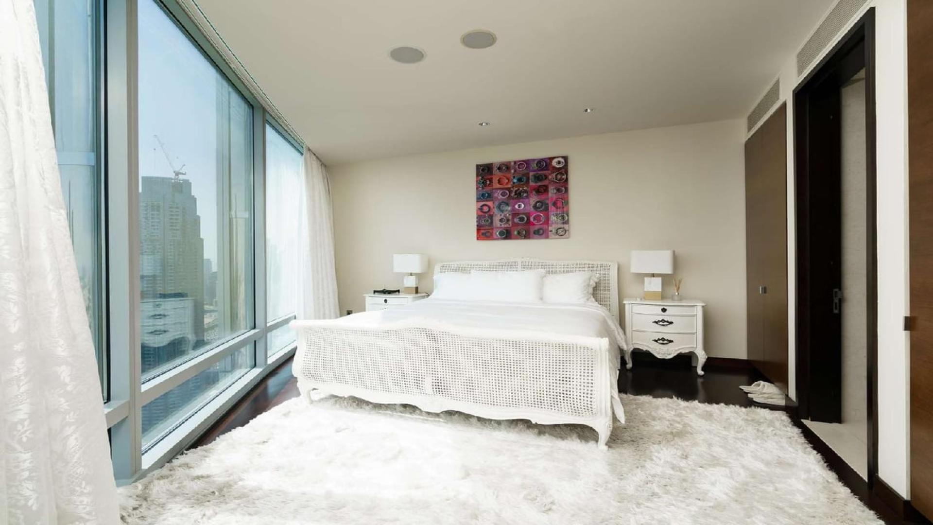 Luxurious furnished living room in Burj Khalifa apartment with panoramic Downtown Dubai views