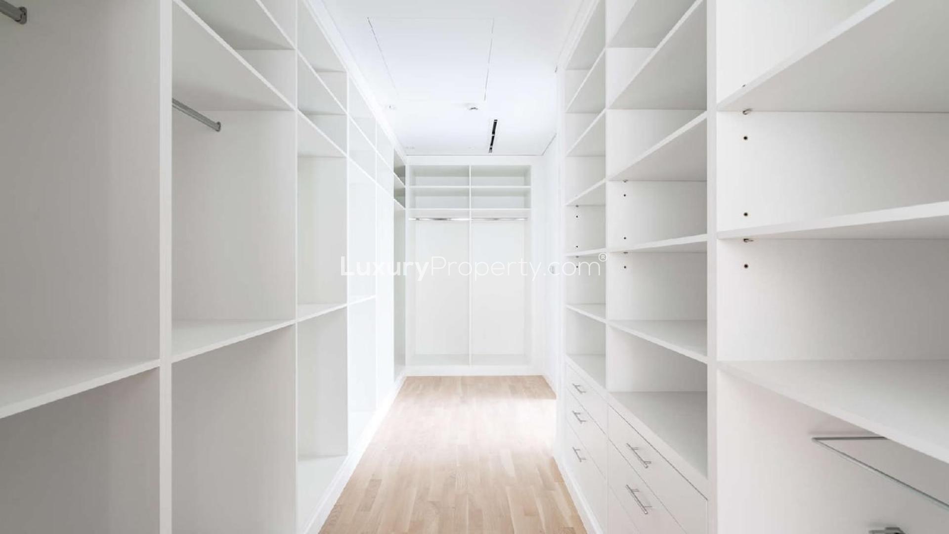 Modern apartment buildings surrounded by lush greenery in Ashjar, Al Barari community