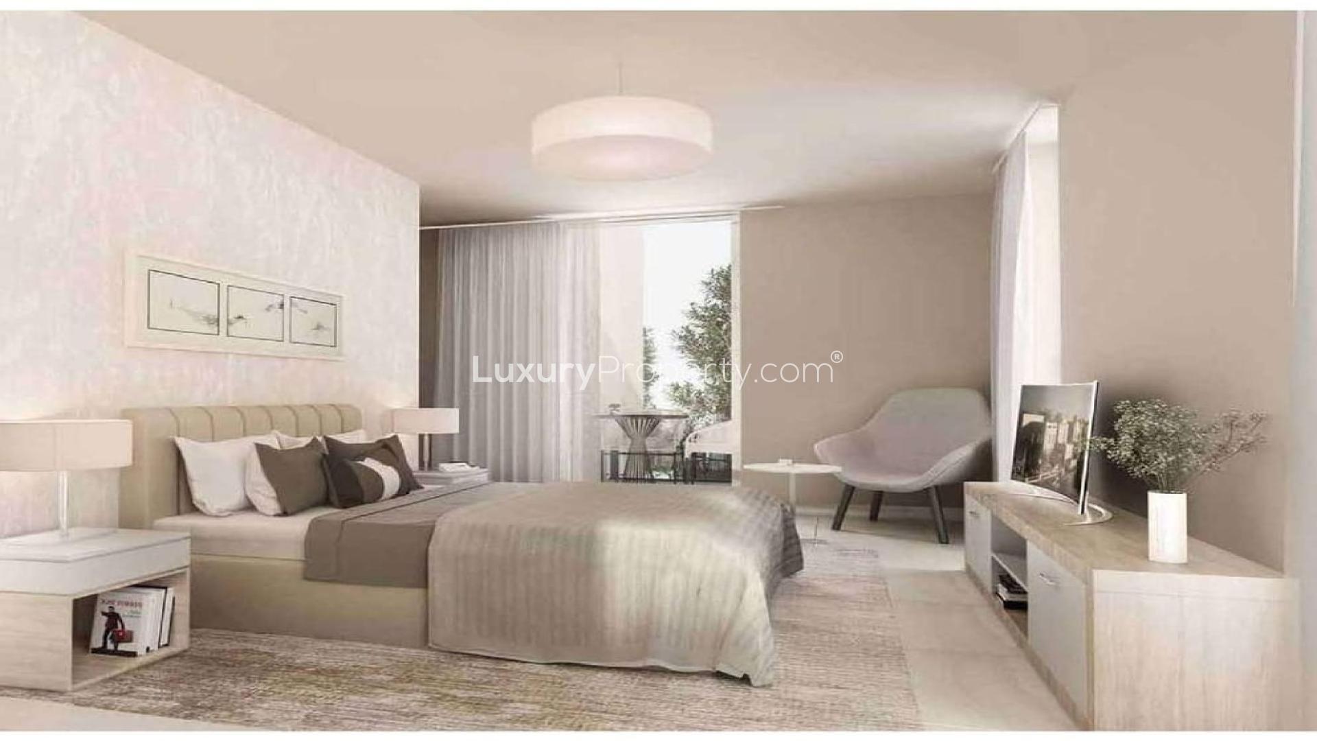Modern living room in Mudon Views apartment with large windows and stylish furniture