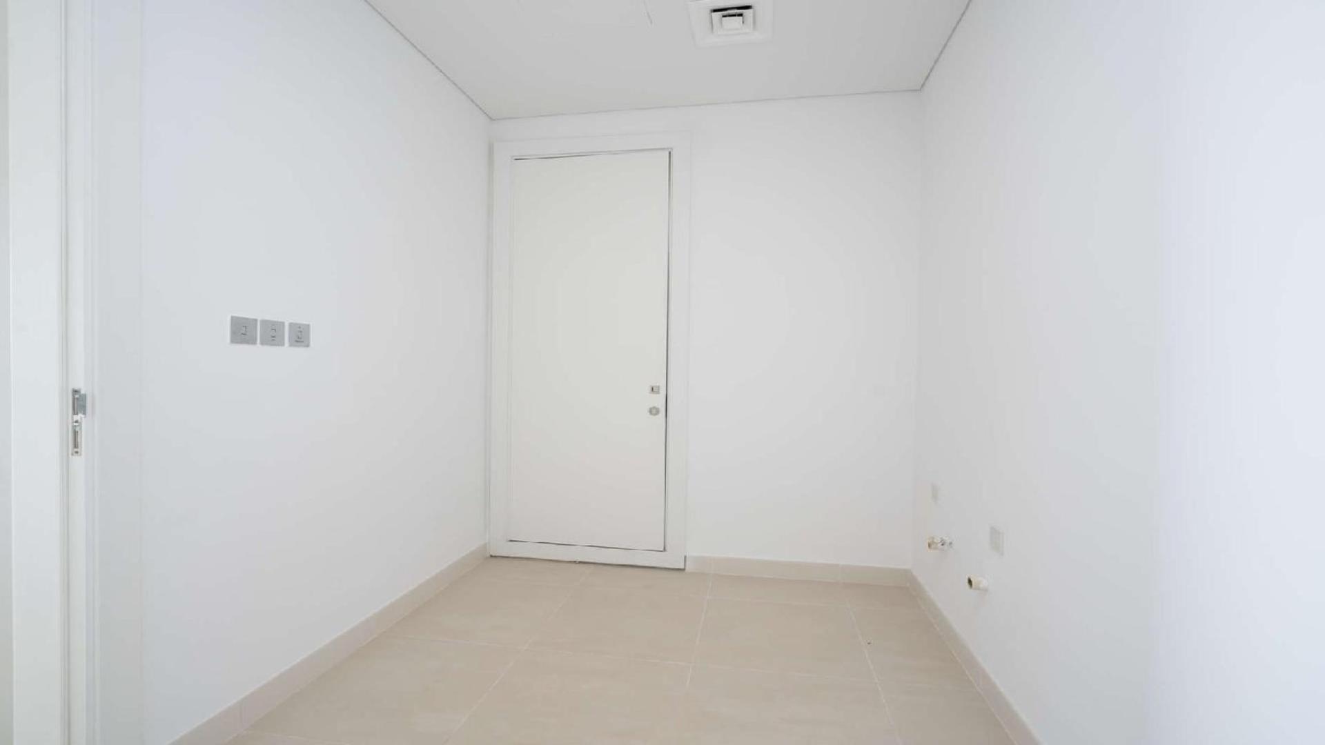 Stylish open-plan kitchen and living area in Seventh Heaven, Al Barari apartment for sale