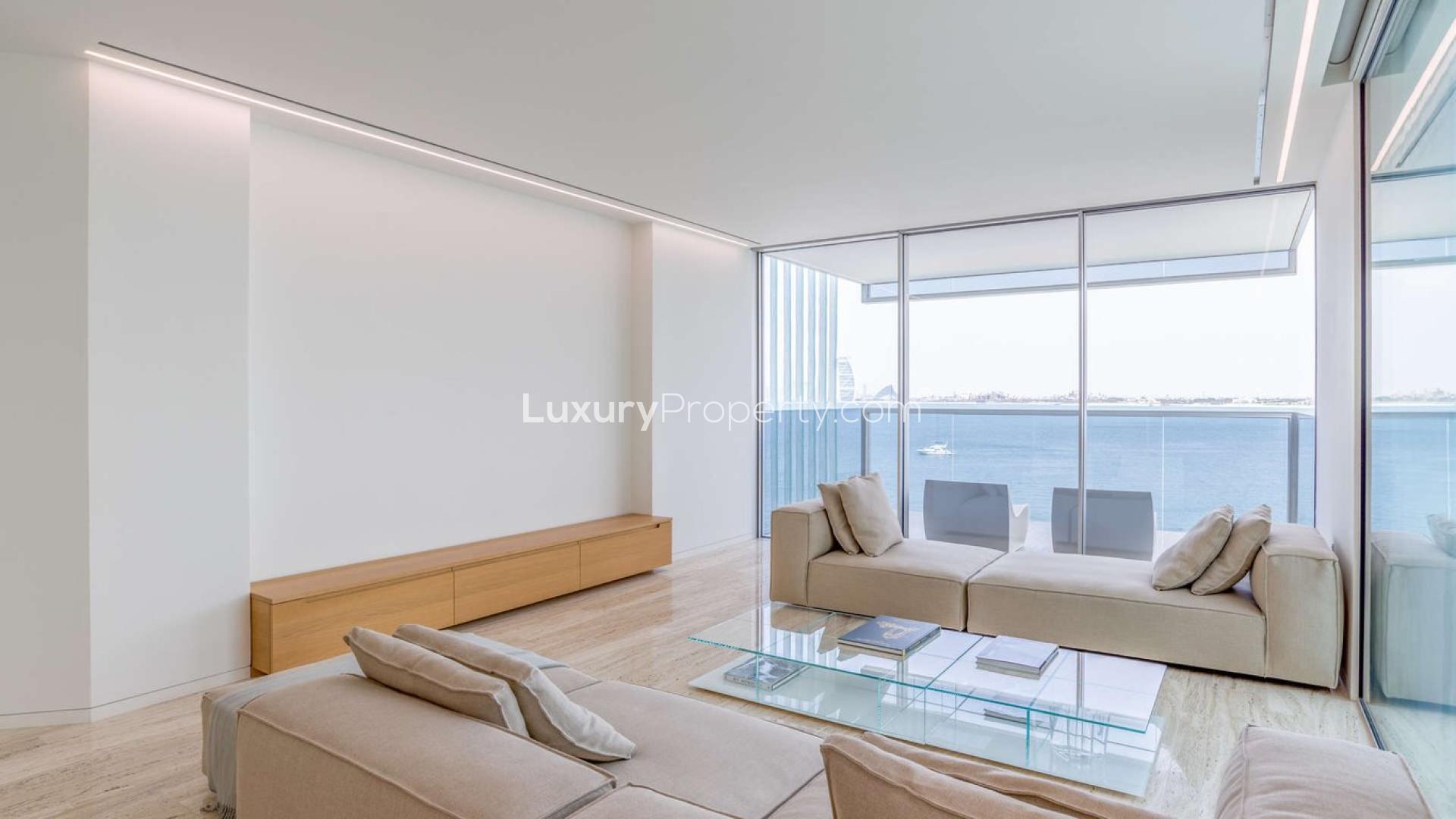 Modern living room in Palm Jumeirah beachfront apartment, featuring elegant decor and ample natural light