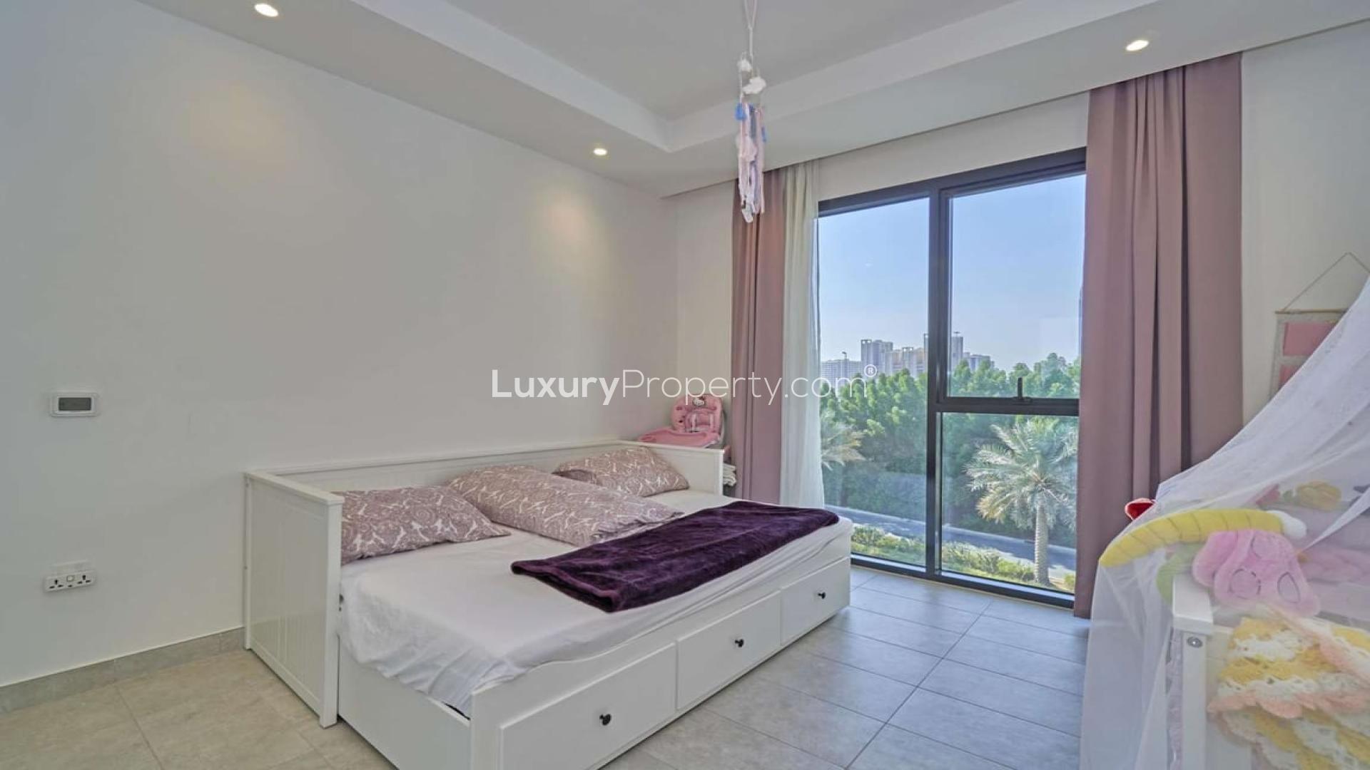 Luxurious living room in Hyati Residences, Jumeirah Village Circle, with modern decor and large windows