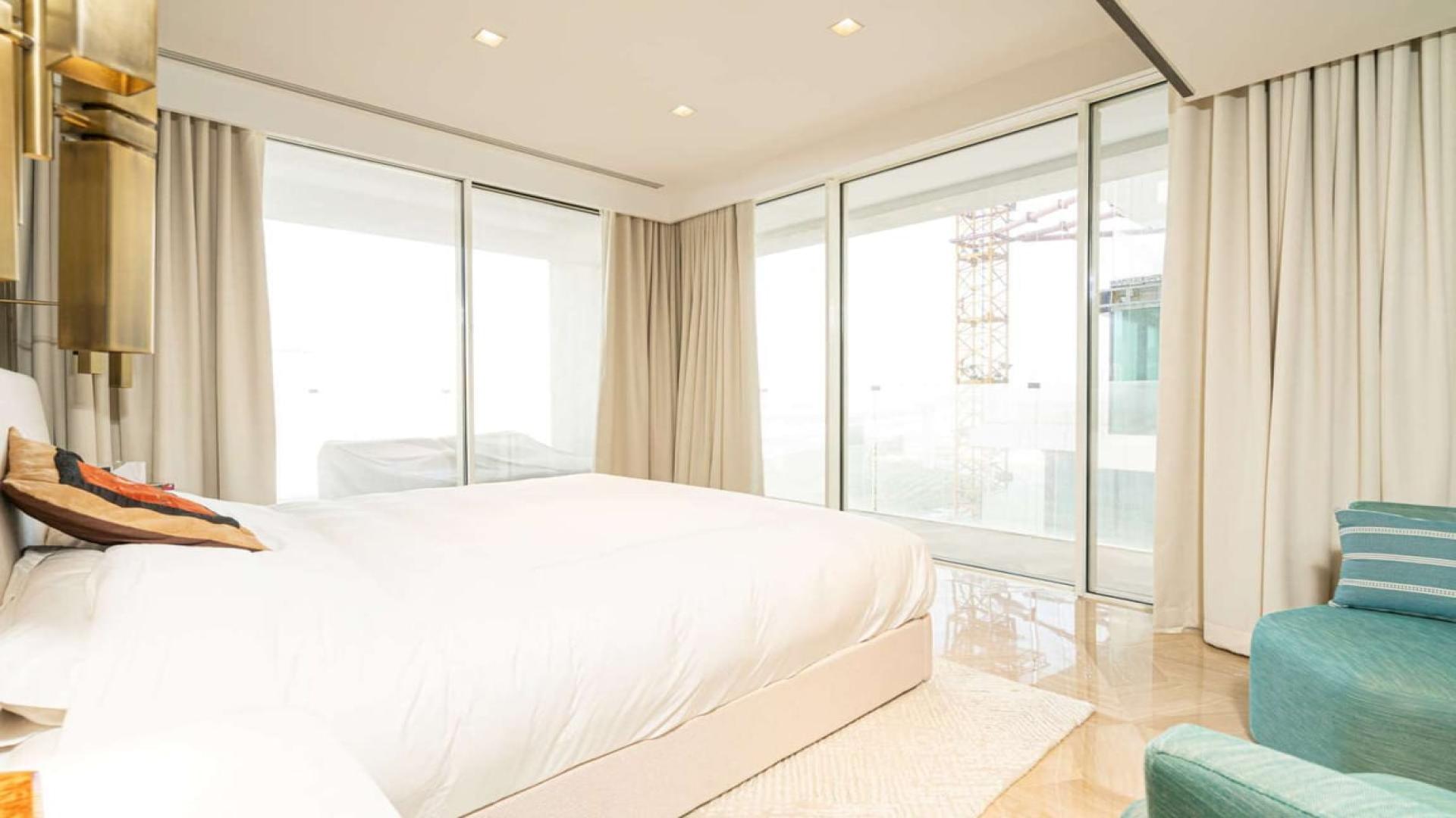 Luxurious living room in two-bedroom apartment, Palm Jumeirah, modern decor, open layout