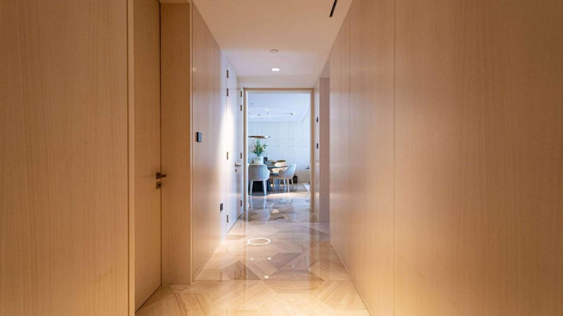 Luxurious living room in two-bedroom apartment, Palm Jumeirah, with balcony view of skyline