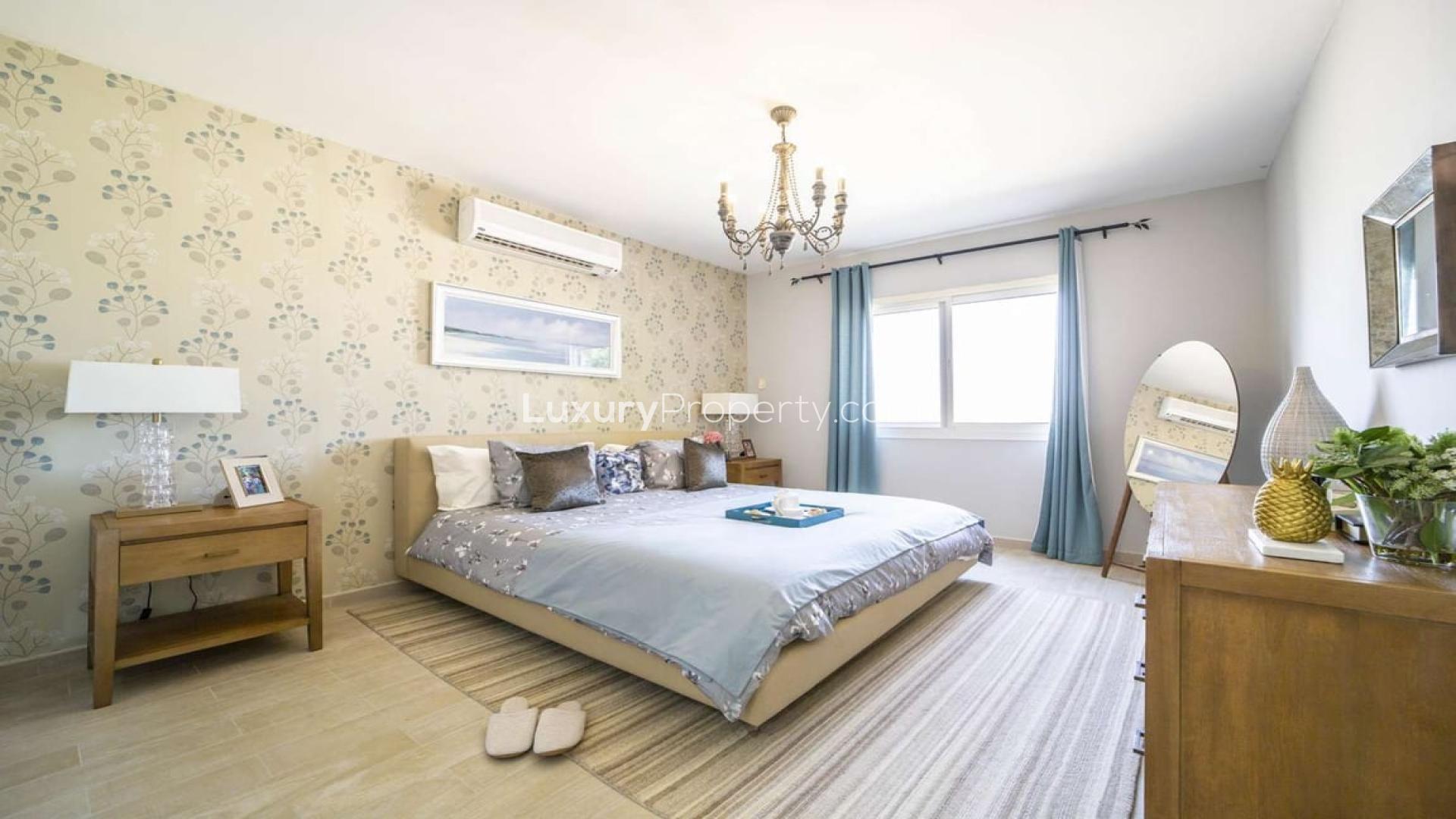 Modern open-plan living room and kitchen in Al Andalus two-bed apartment for sale