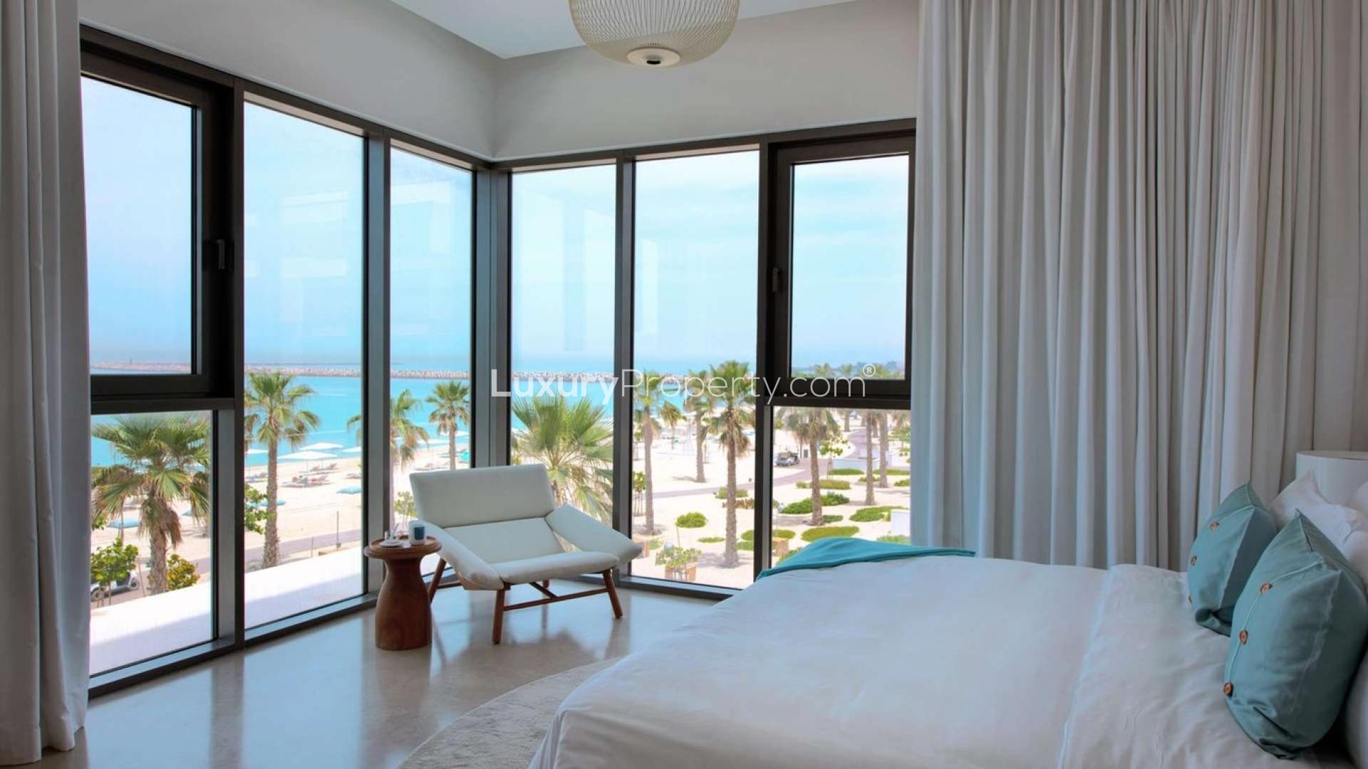 Contemporary living room with ocean view at Nikki Beach apartment, Pearl Jumeirah, Jumeirah