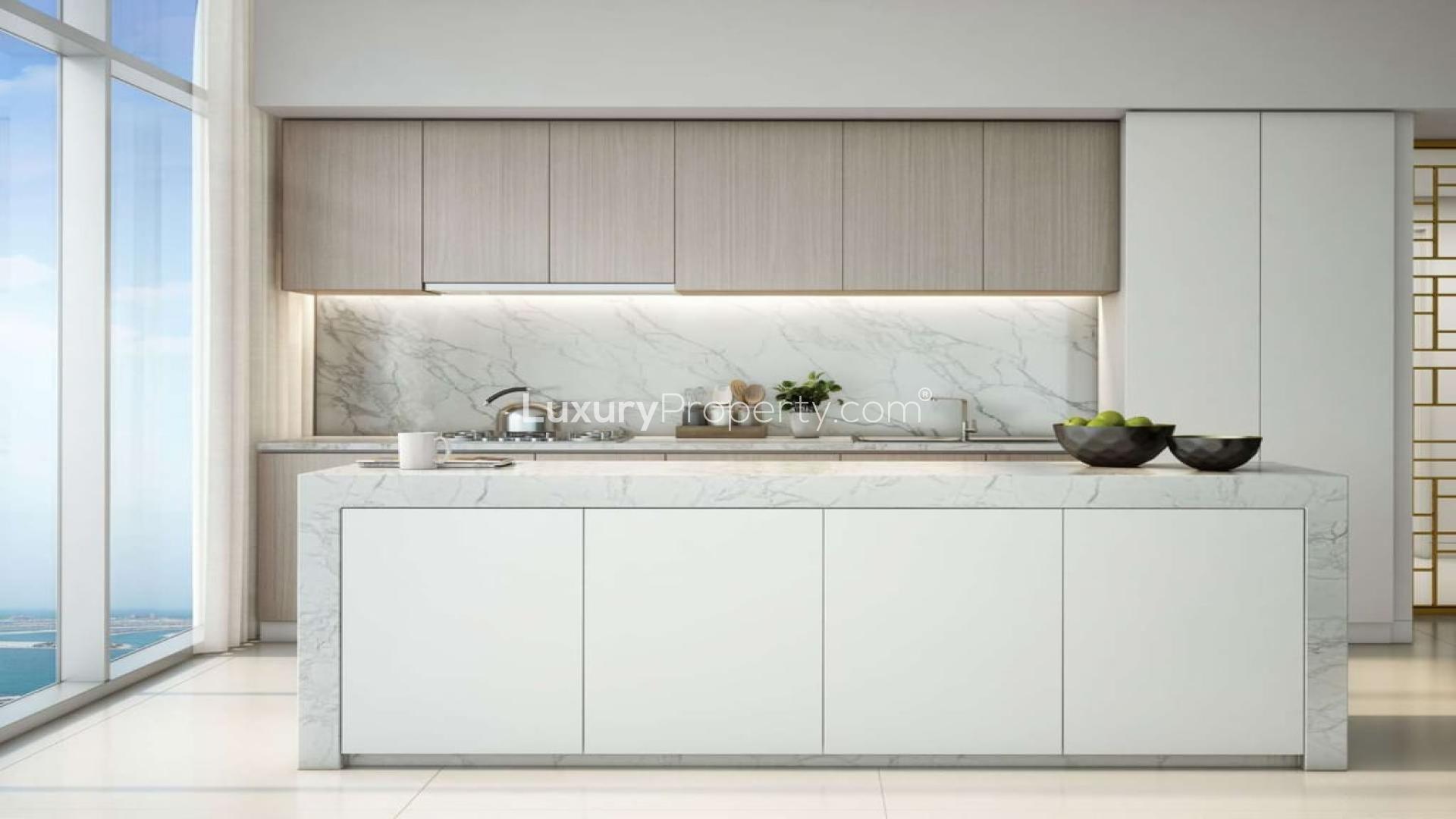 Modern kitchen in two-bedroom apartment, Emaar Beachfront, Dubai Harbour with marble countertops and cabinets