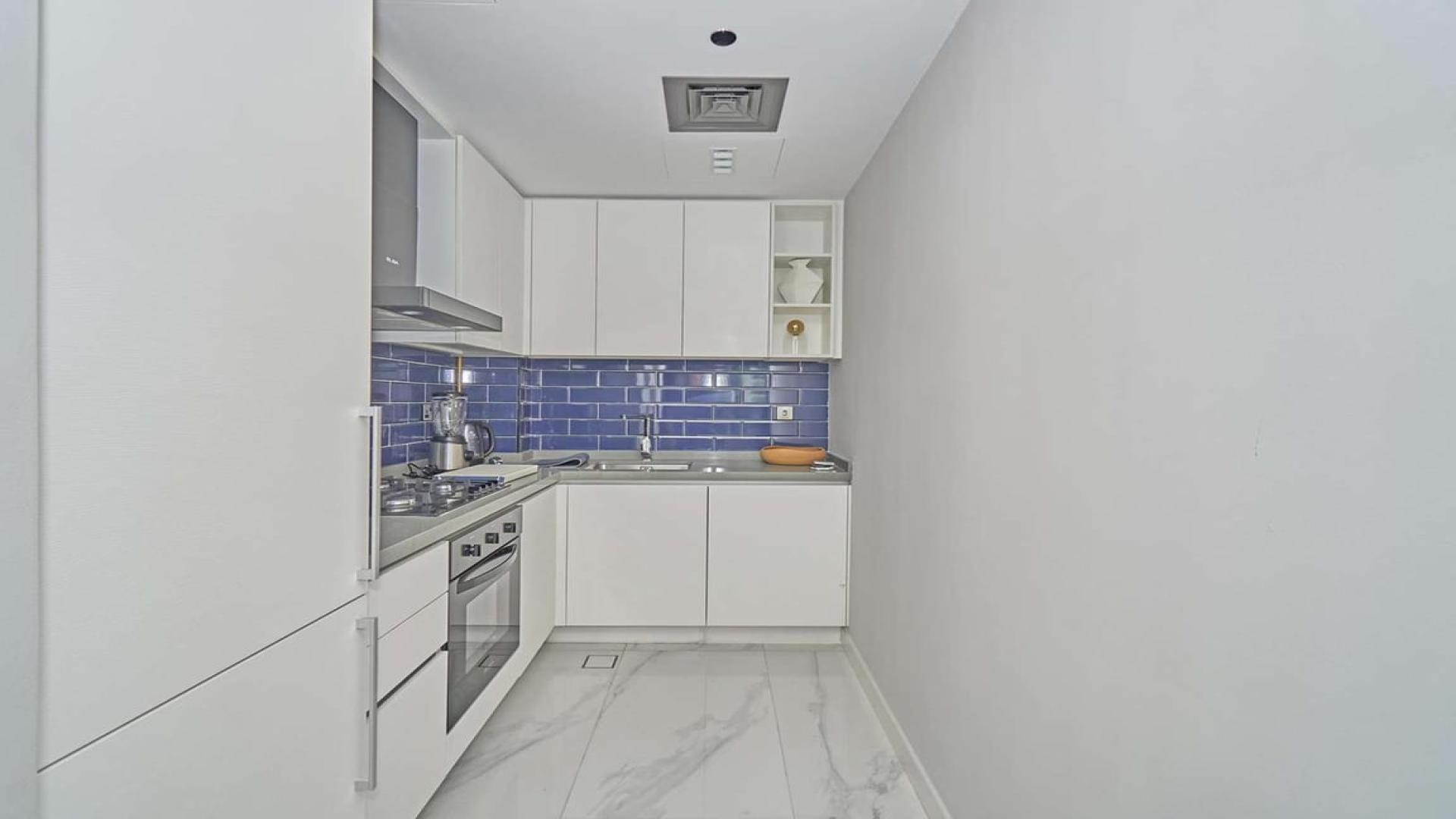 Modern living room in MAG 318 apartment, Business Bay, with balcony view, for sale