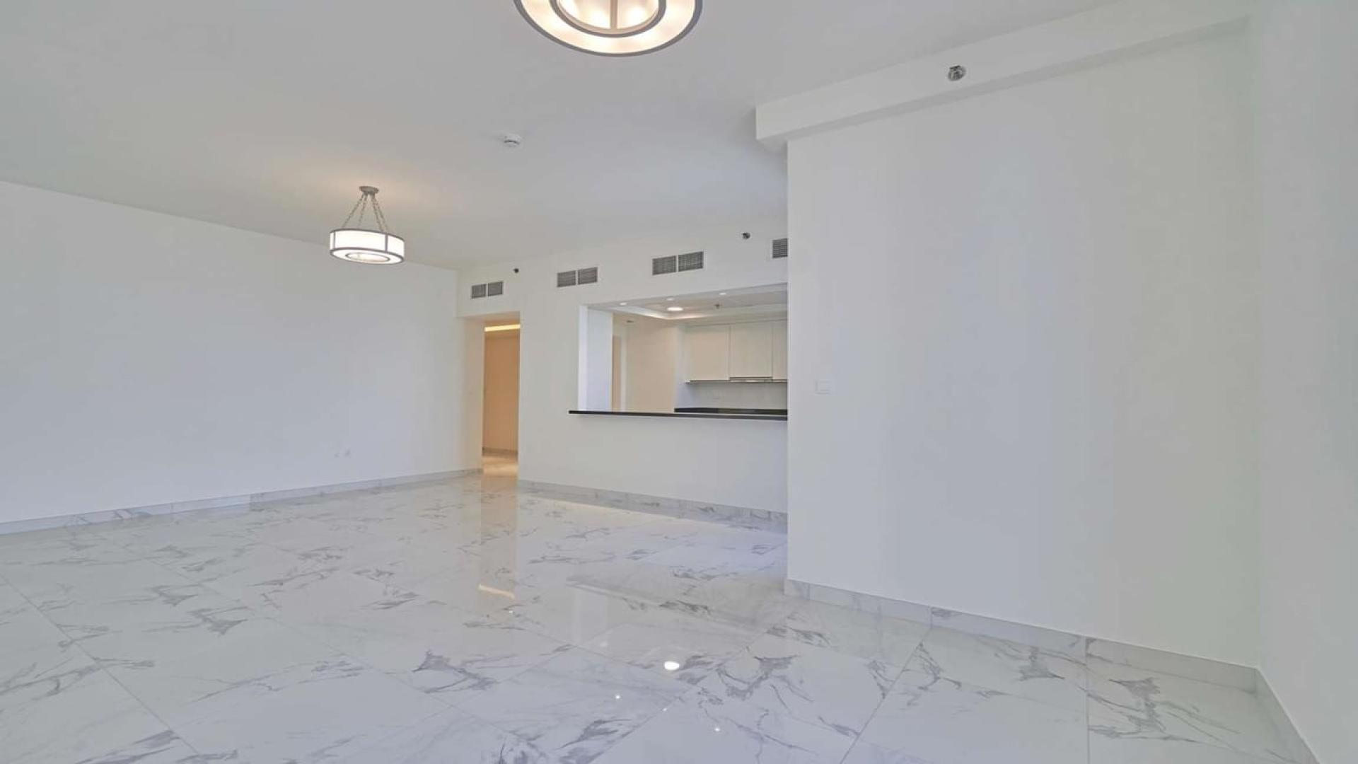 Spacious living area with marble floors in Business Bay two-bedroom apartment for sale
